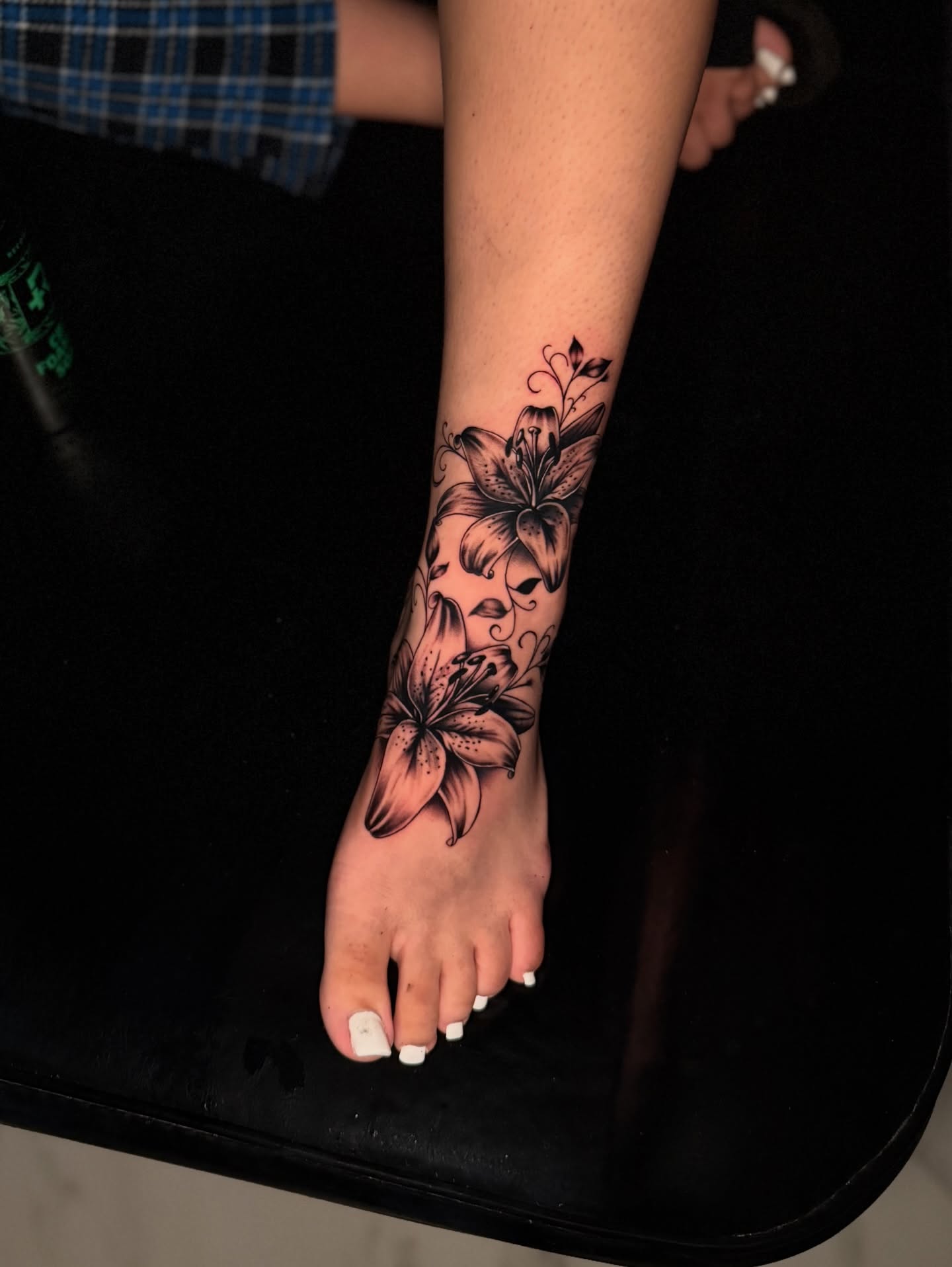 Lily flowers black and grey tattoo on the foot by InkbyCasillas