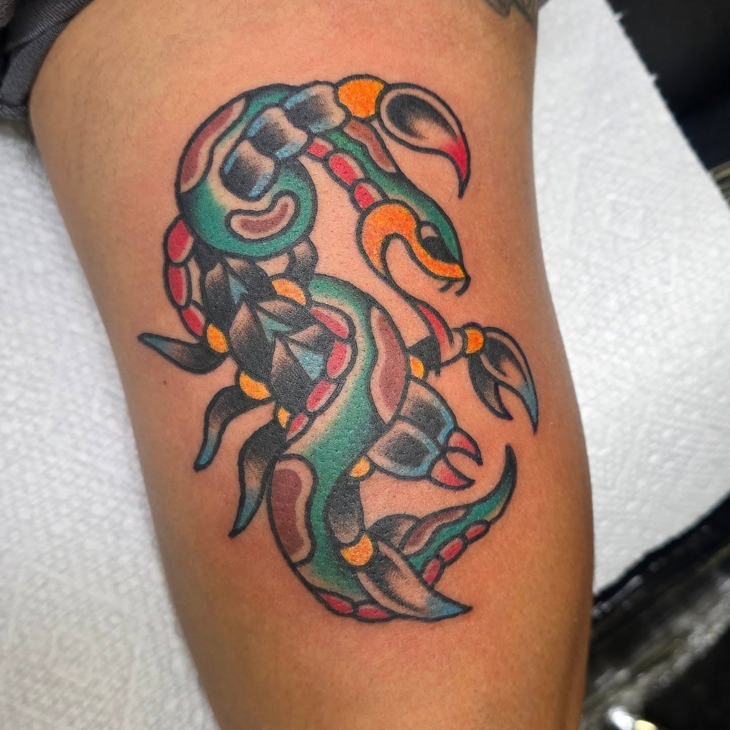 Scorpion American traditional tattoo on the thigh by A. Teixeira, Los Angeles, California