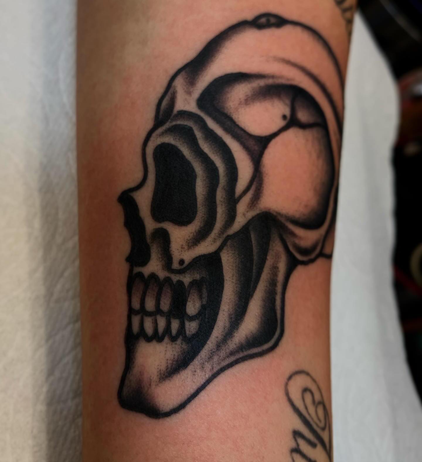 Skull black and grey tattoo on the forearm by Brandon Heredia, Vacaville, California