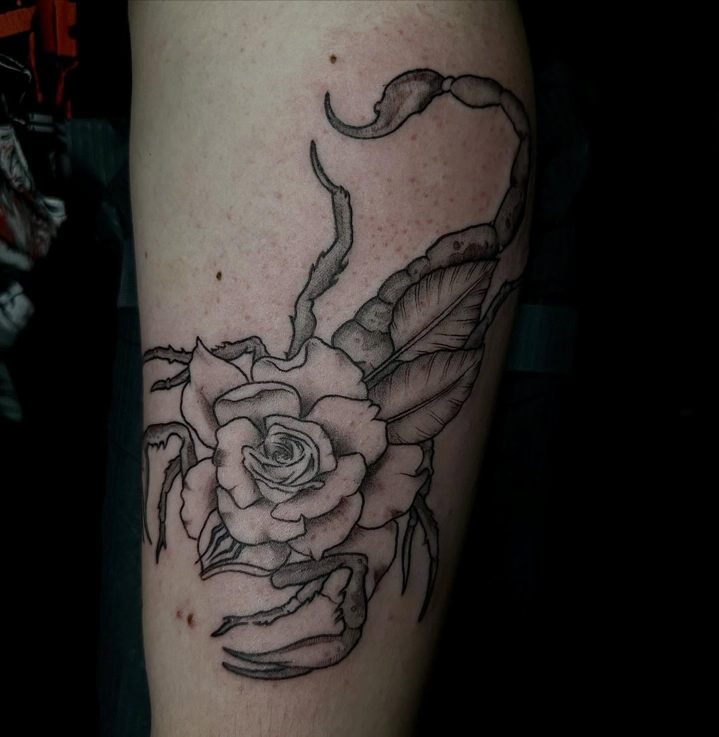 Rose and scorpion realism tattoo on the forearm by emma christine