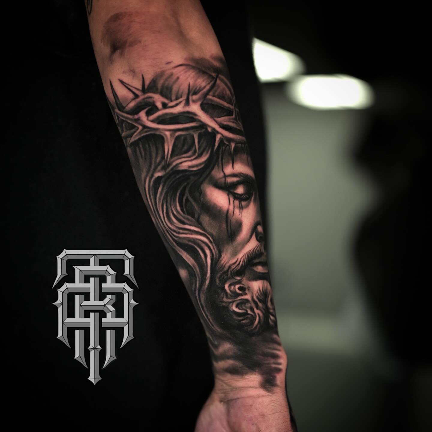 Jesus Christ realism tattoo on the forearm by Art Lopez