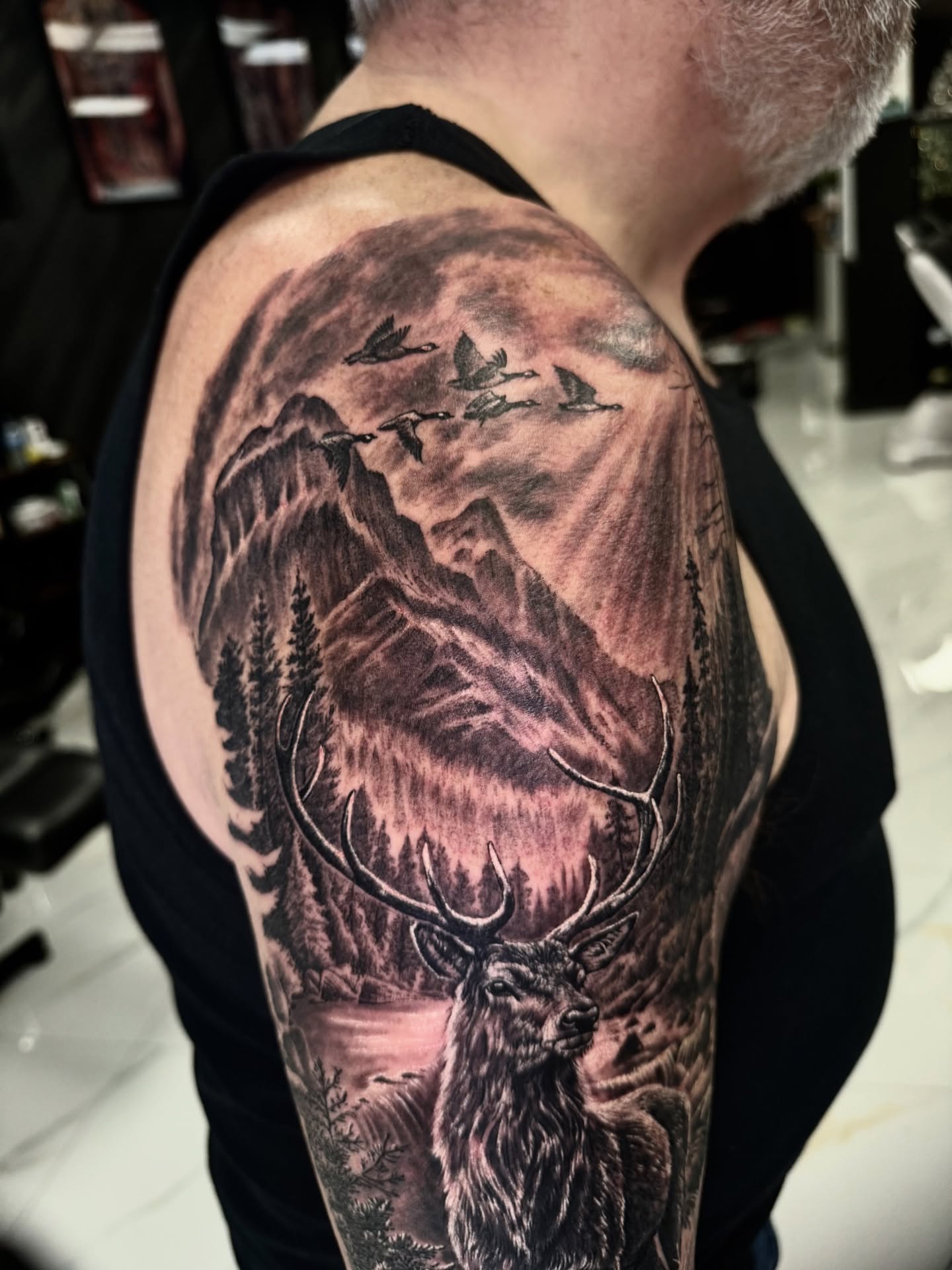 Tattoo by @tuannguyen_tattoo — realism, black_and_grey