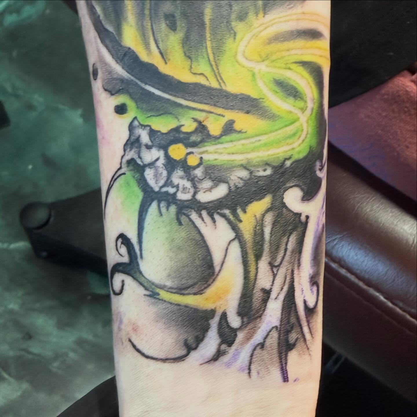 Abstract nature watercolor tattoo on the forearm by Devon Beyer, Mission, Kansas