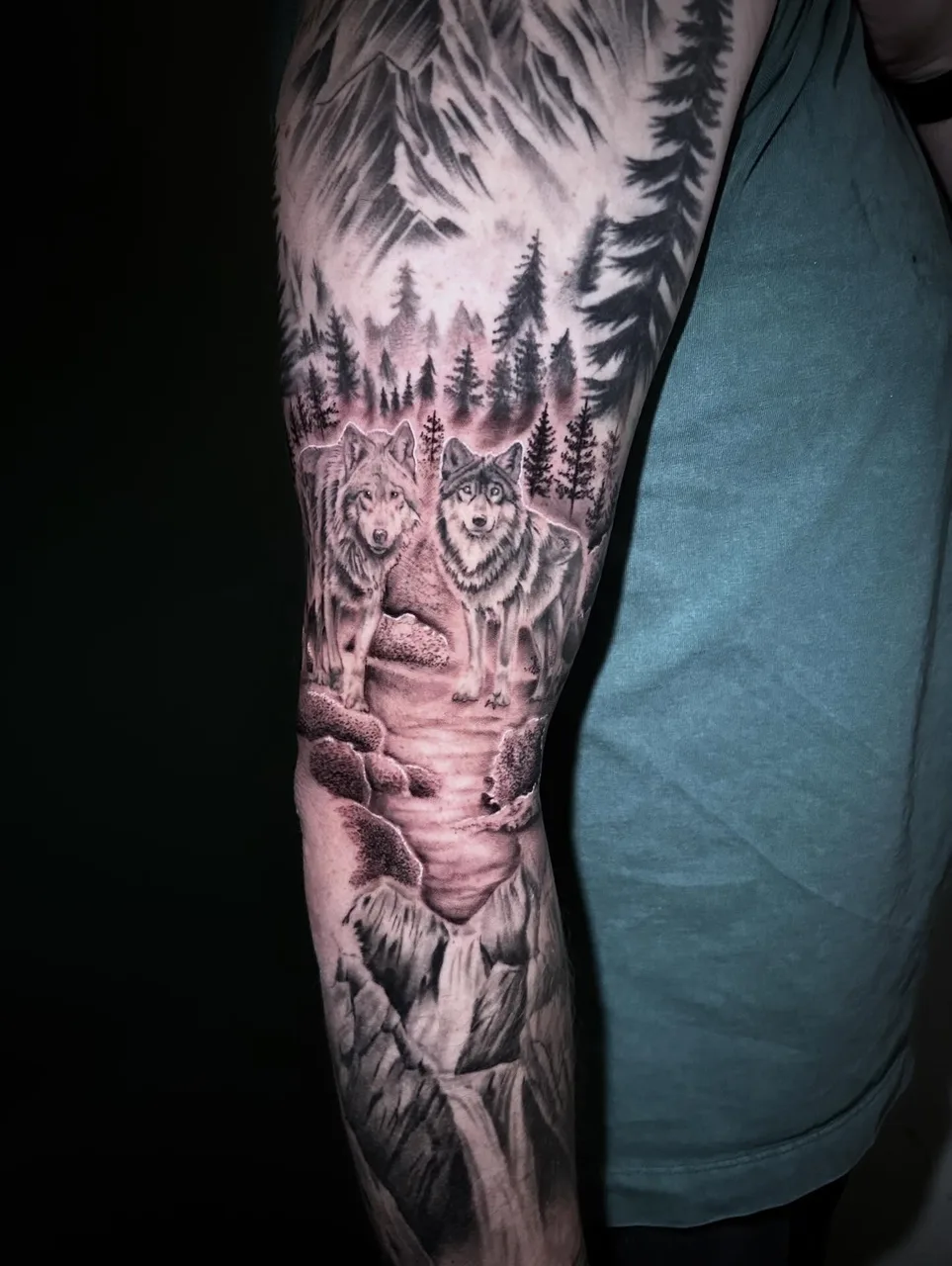 Wolves in forest realism tattoo on the forearm by Dylan Stevens
