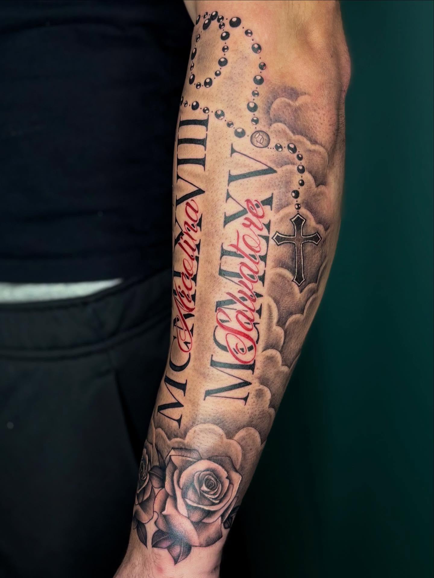 Religious symbols and text black and grey tattoo on the forearm by ༺☆༻