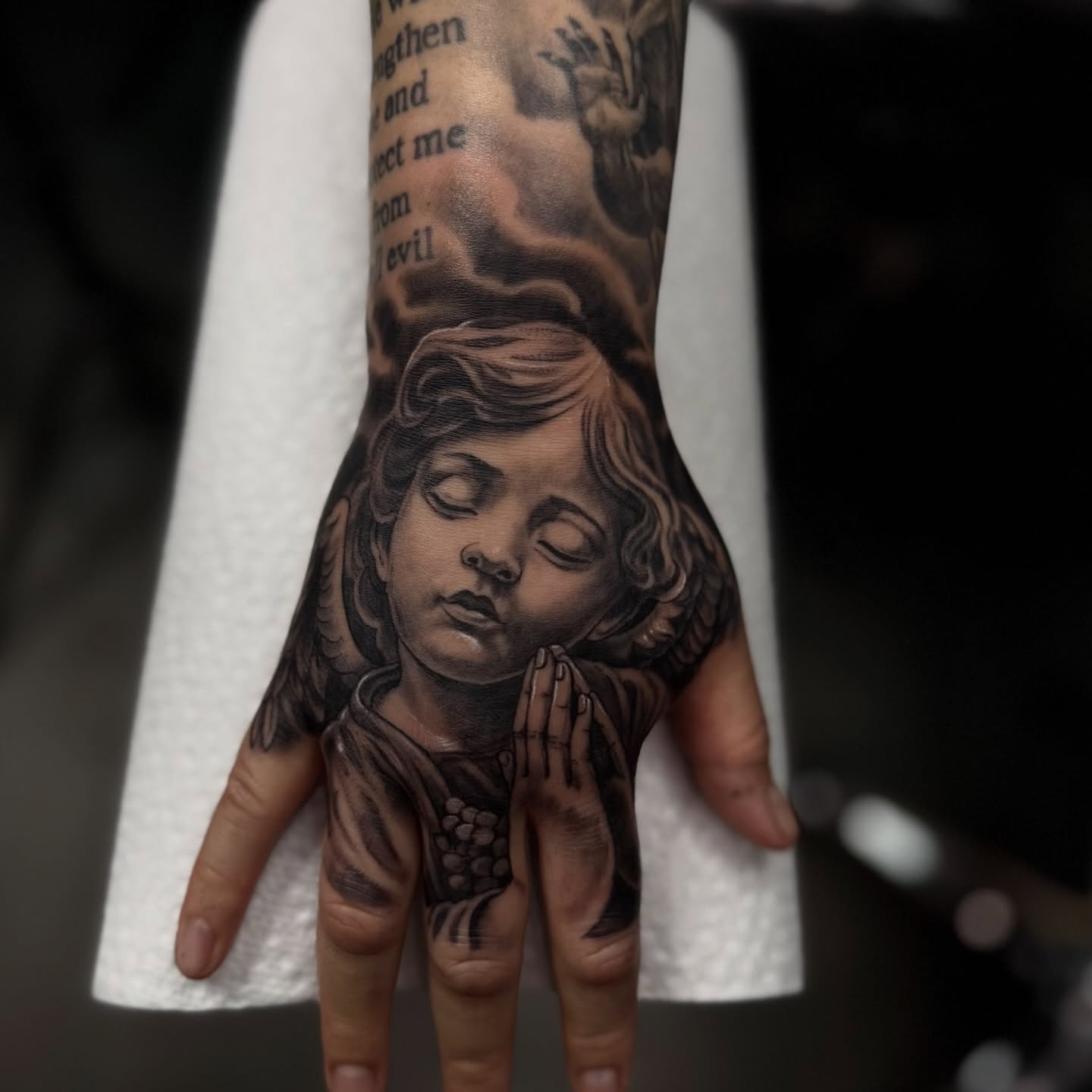 Praying child realism tattoo on the hand by Tony Hernandez, Chicago, Illinois
