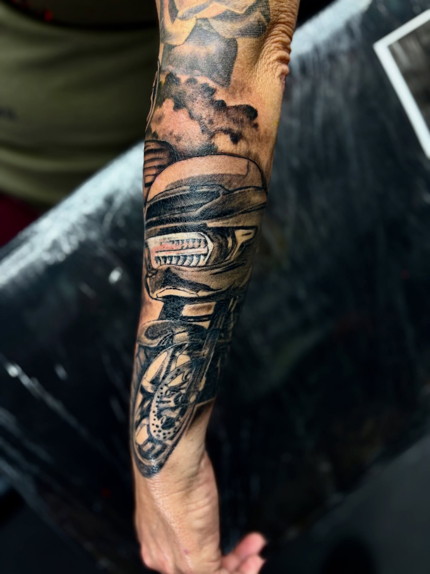 Cyborg head realism tattoo on the forearm by Deacon Moser