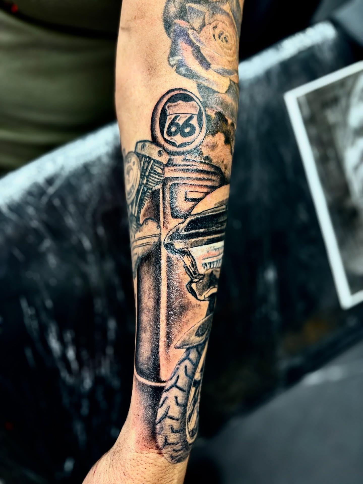 Motorcycle American traditional tattoo on the forearm by Deacon Moser