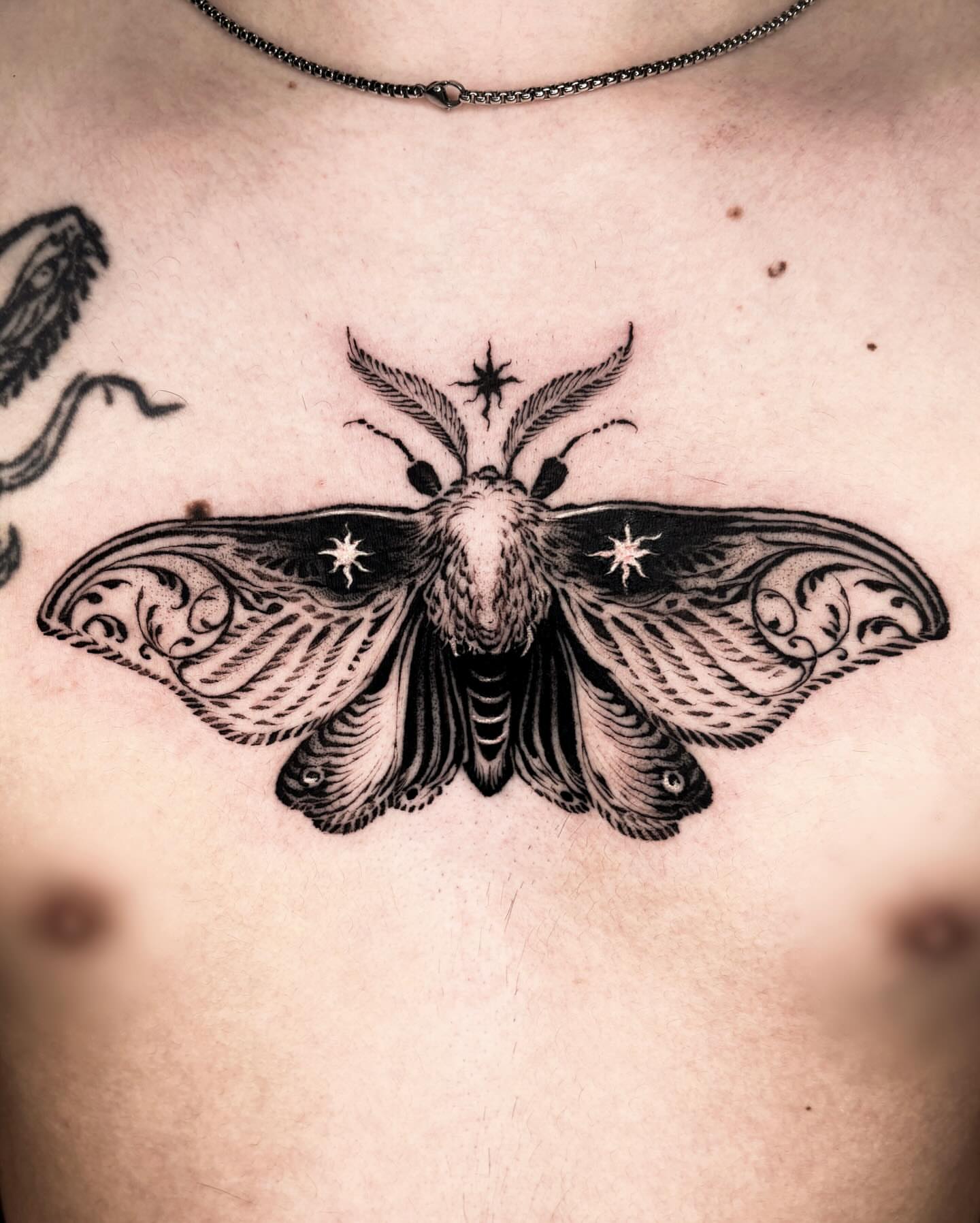 Moth black and grey tattoo on the chest by 우레