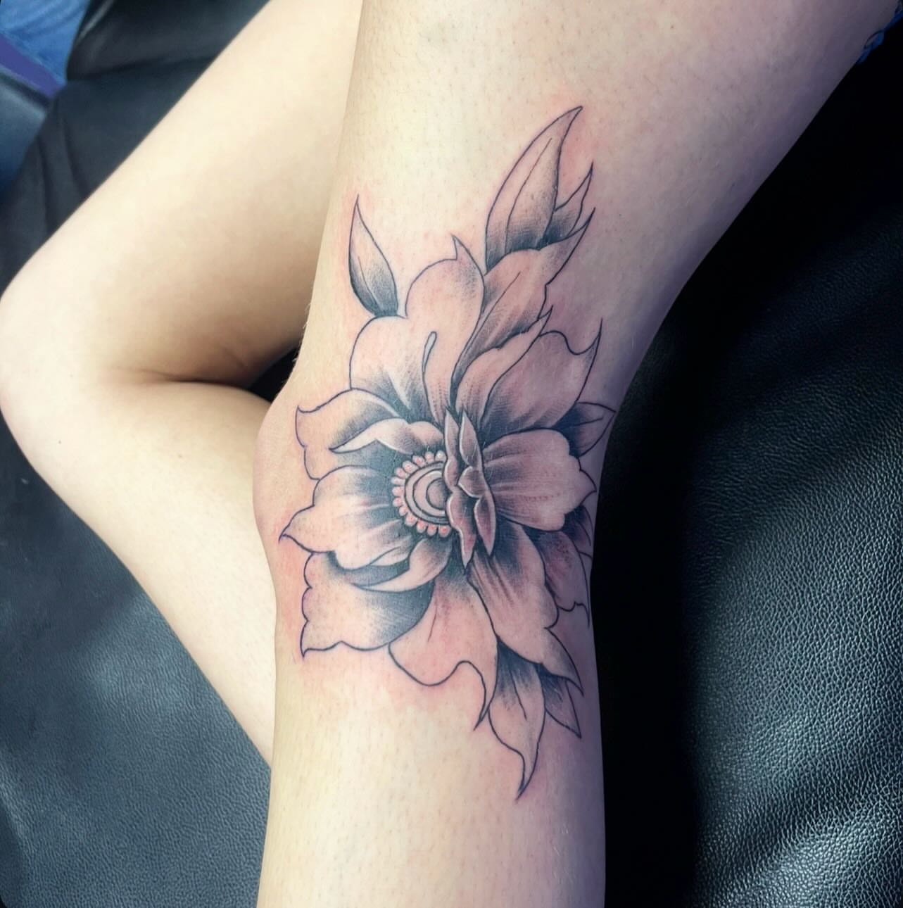 Flower black and grey tattoo on the forearm by Mark Calloway
