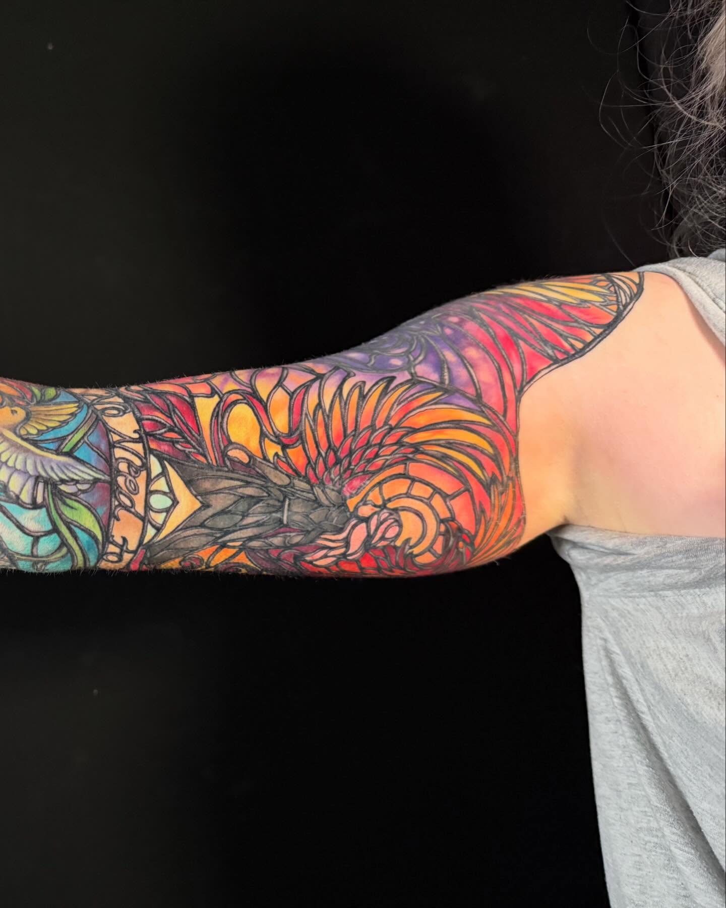 Abstract floral new school tattoo on the forearm by Jade Lewis