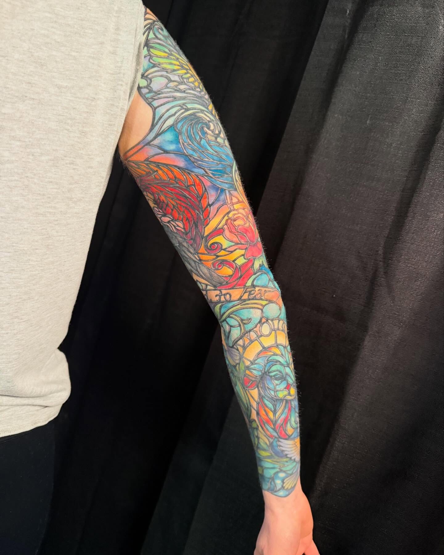 Abstract floral design new school tattoo on the forearm by Jade Lewis