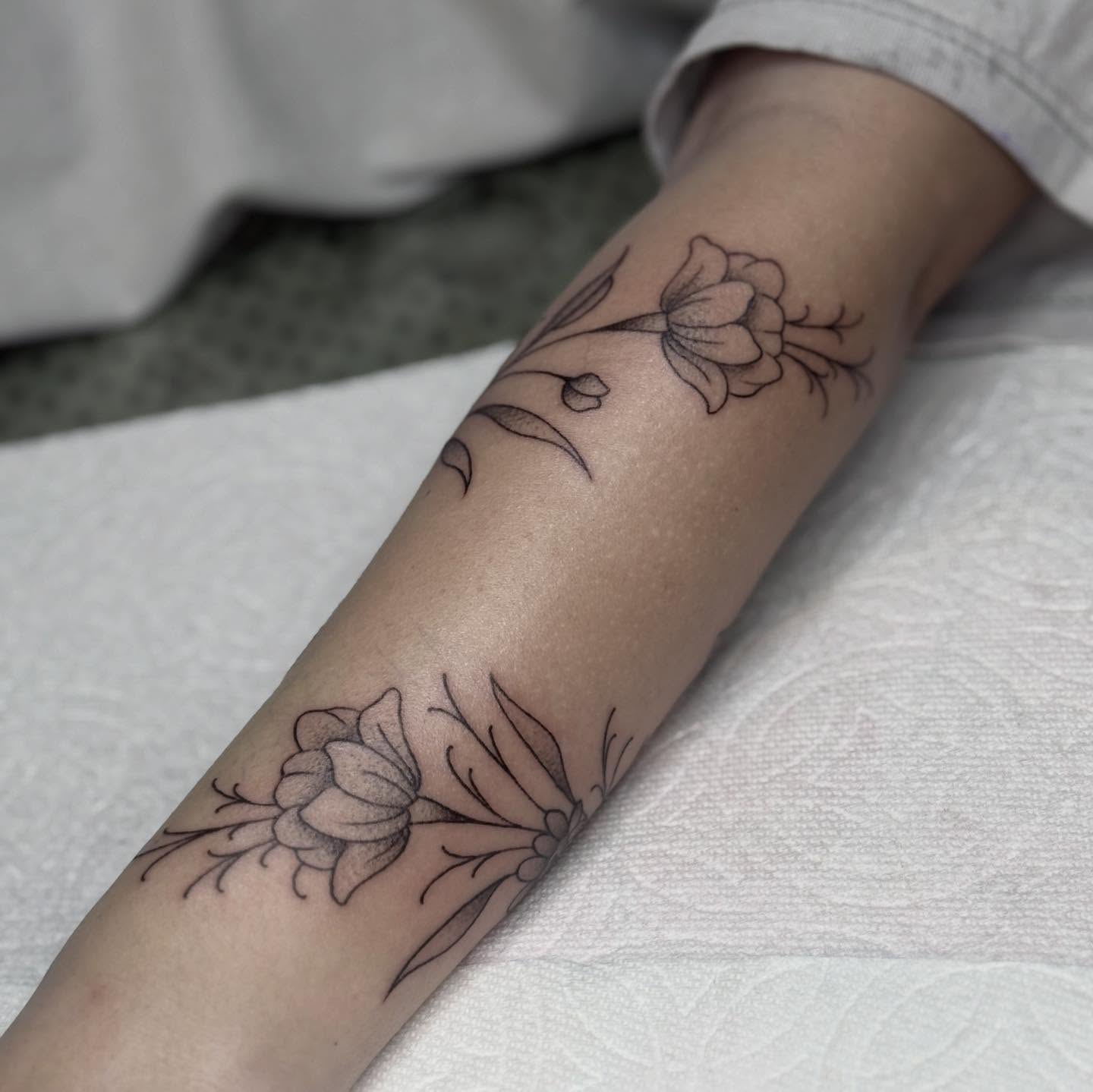 Flowers black and grey tattoo on the forearm by chloe jeanel estrada