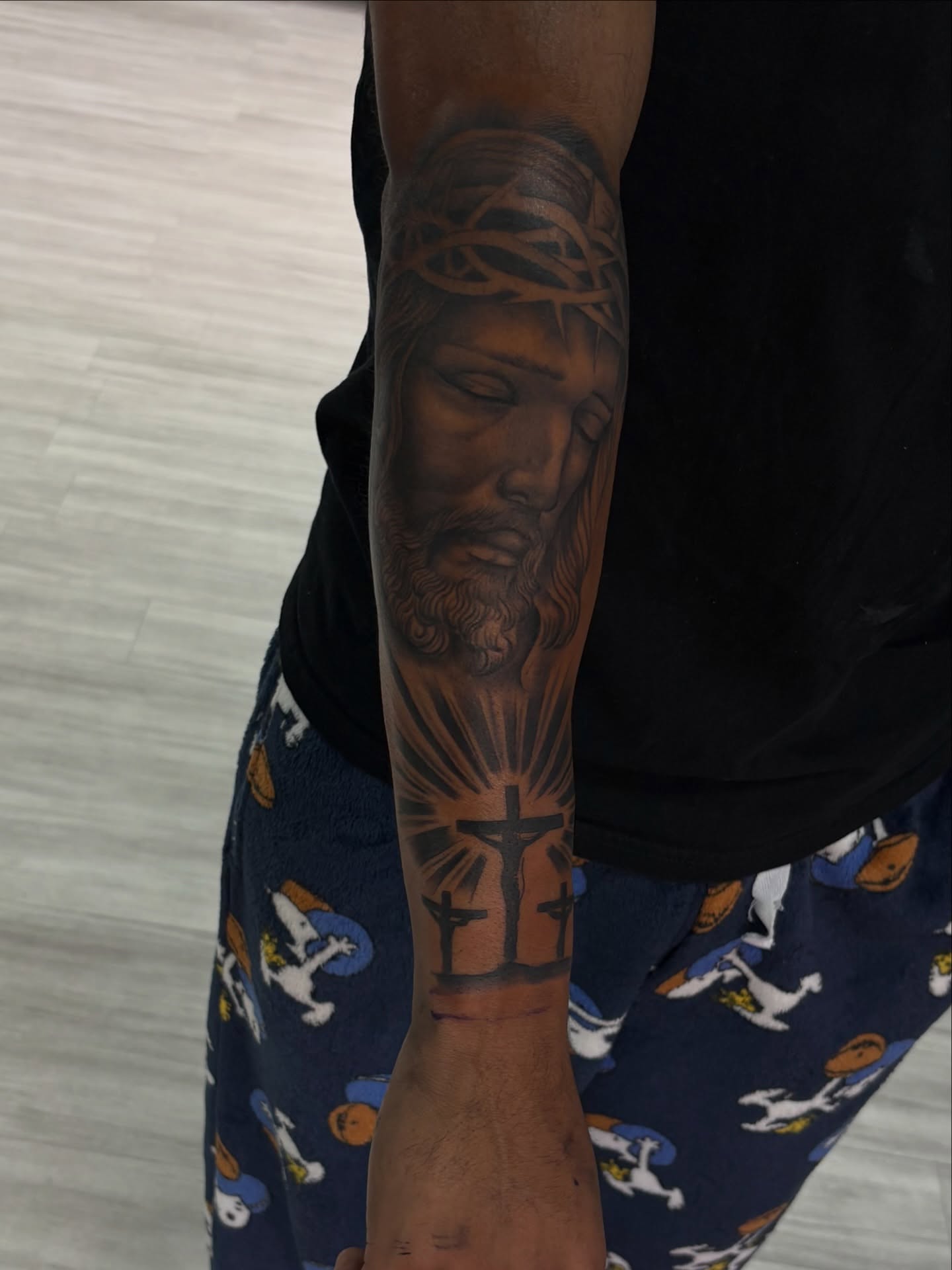 Religious figure realism tattoo on the forearm by Savannah Tattoo Artist