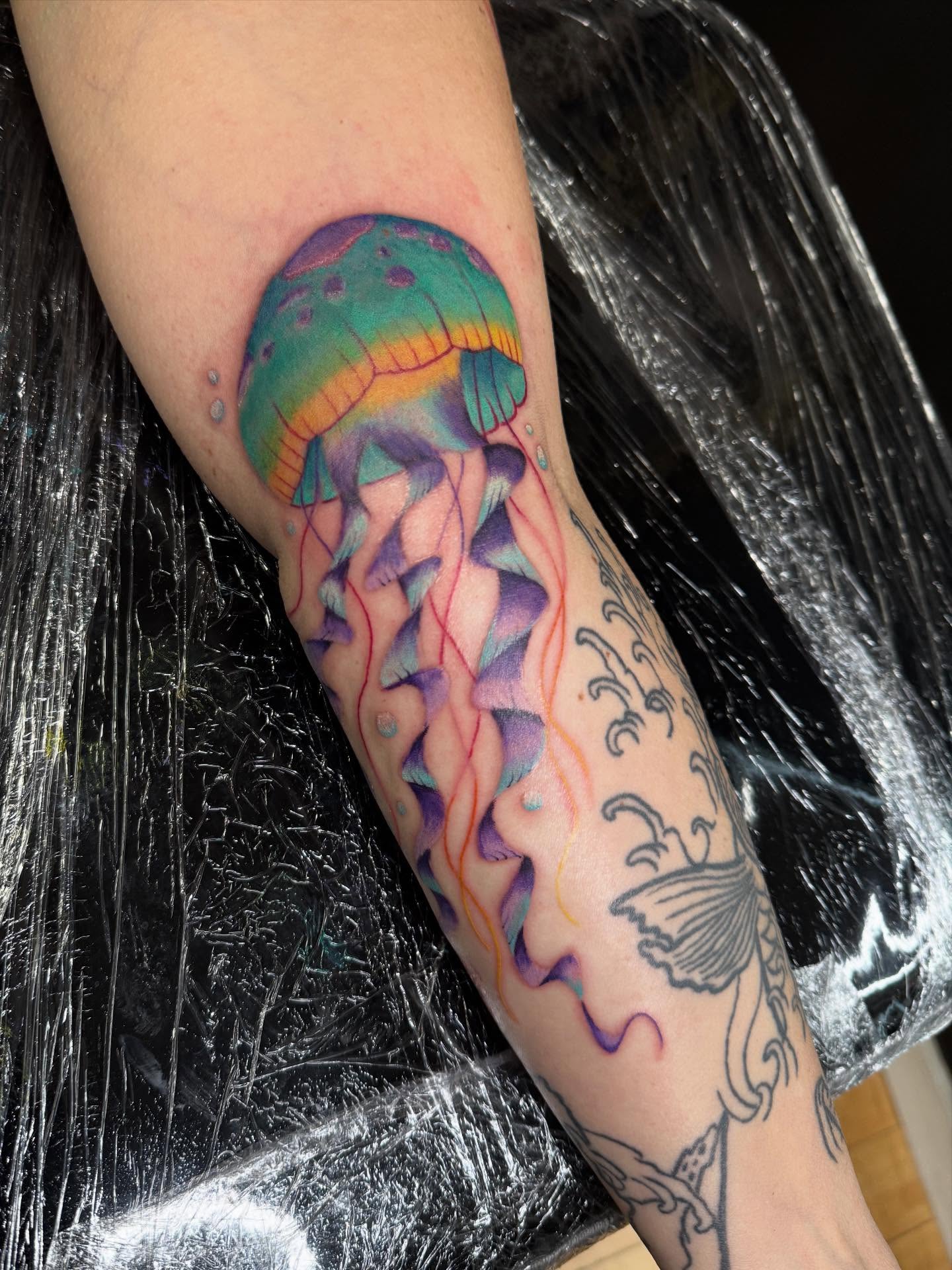 Jellyfish realism tattoo on the forearm by Ashley Hsiung *Panda*