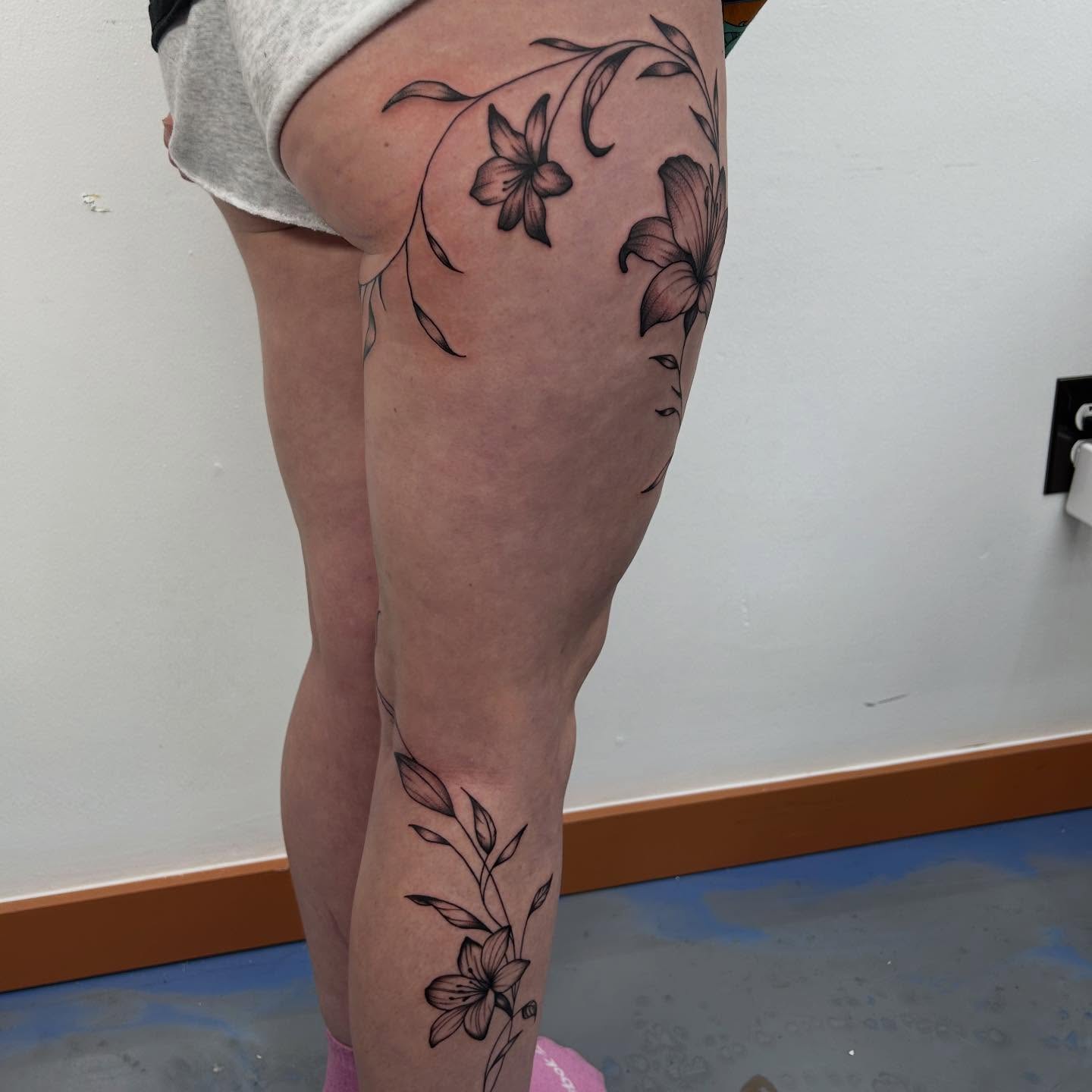 Lily flowers black and grey tattoo on the thigh by Lip™
