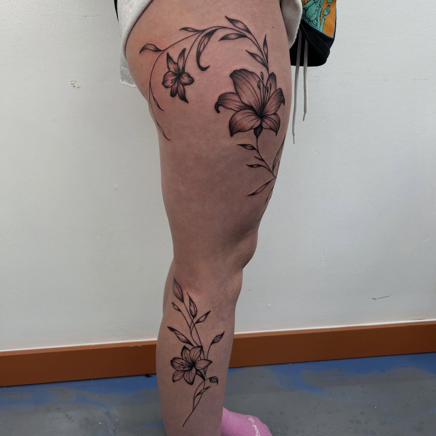 Lily flowers black and grey tattoo on the thigh by Lip™