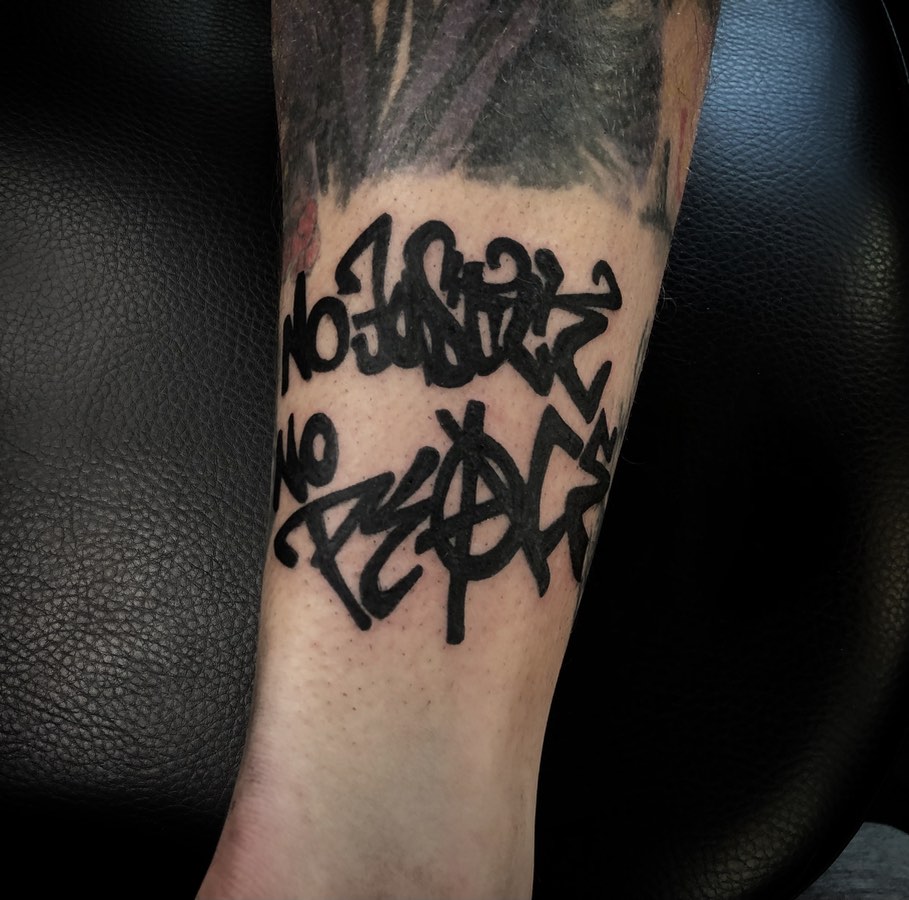 Graffiti lettering tattoo on the forearm by Ink of Winchester