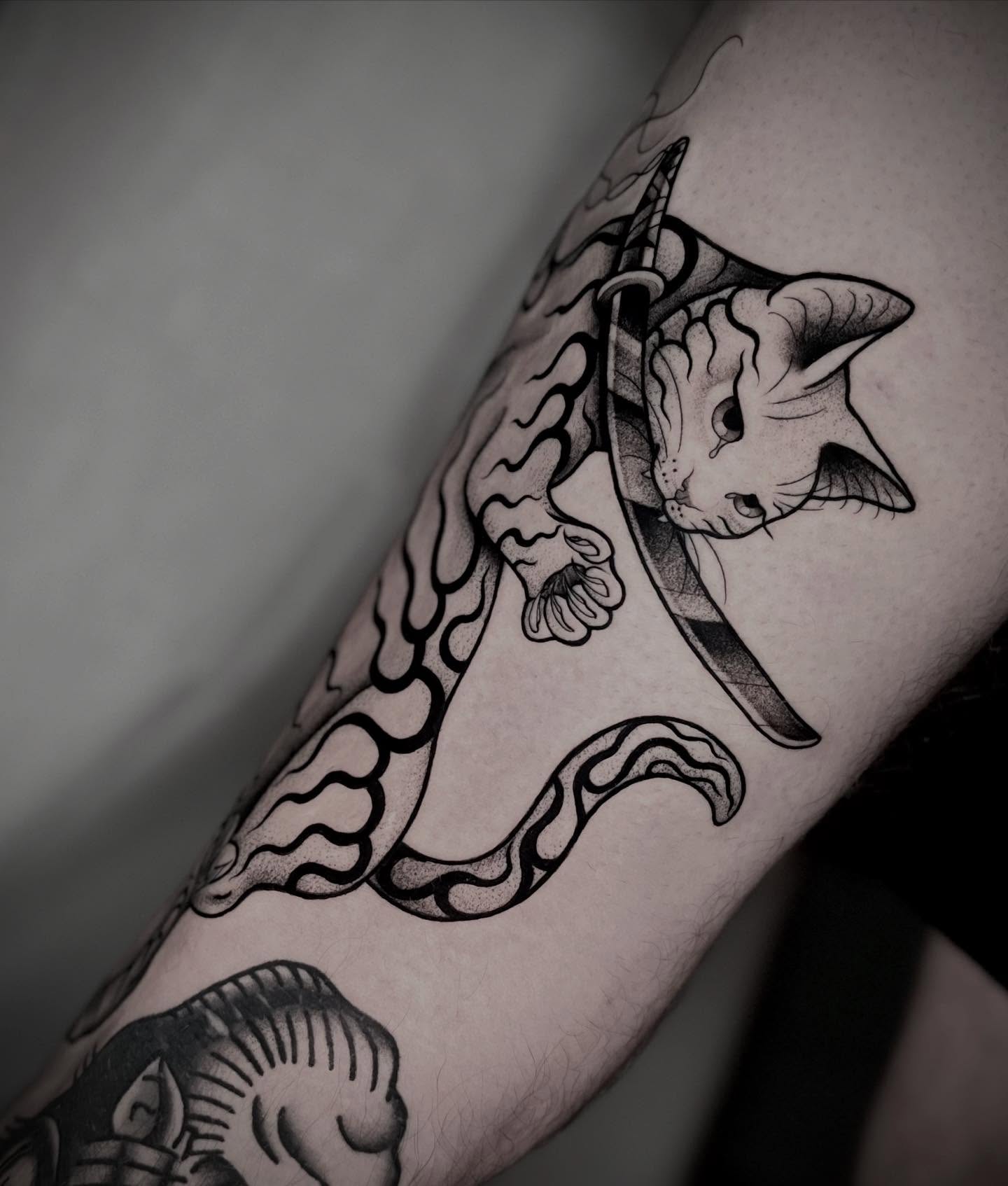 Cat with sword black and grey tattoo on the forearm by Martha Gual π€ East ATX Tattooer