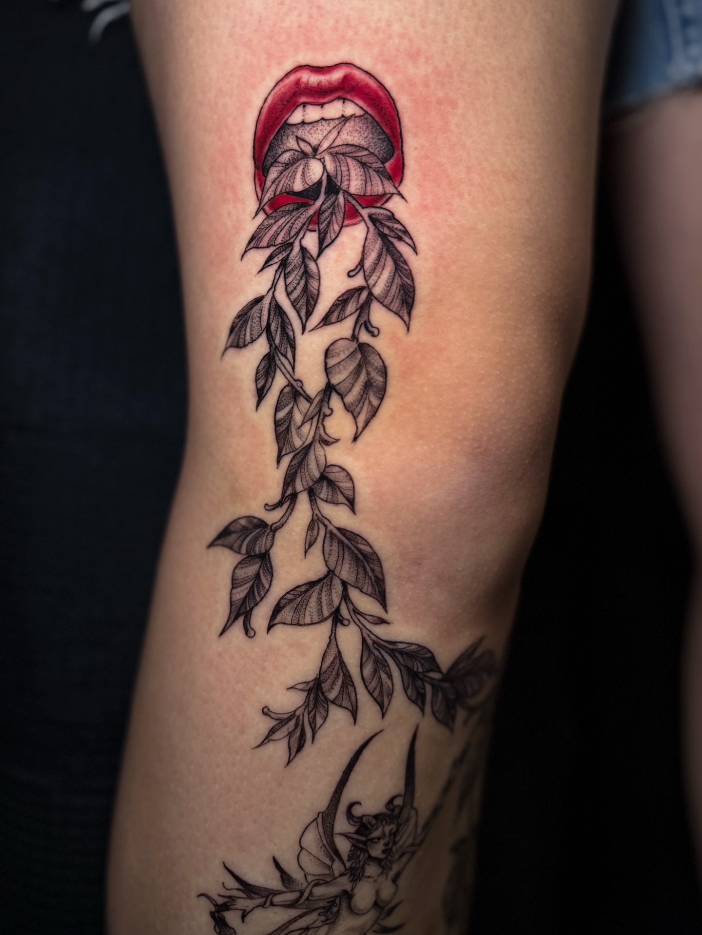 Mouth with plant neo-traditional tattoo on the forearm by Cristen Aro