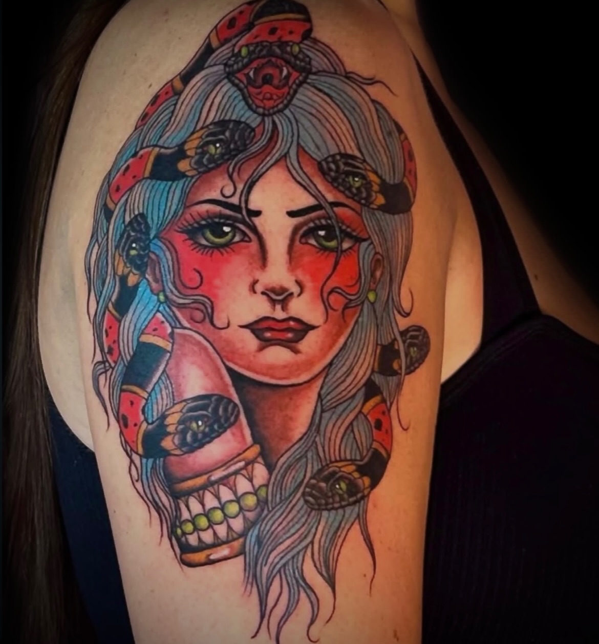 Woman with snakes American traditional tattoo on the shoulder by Kat McCoy Guidera, Nashville, Tennessee