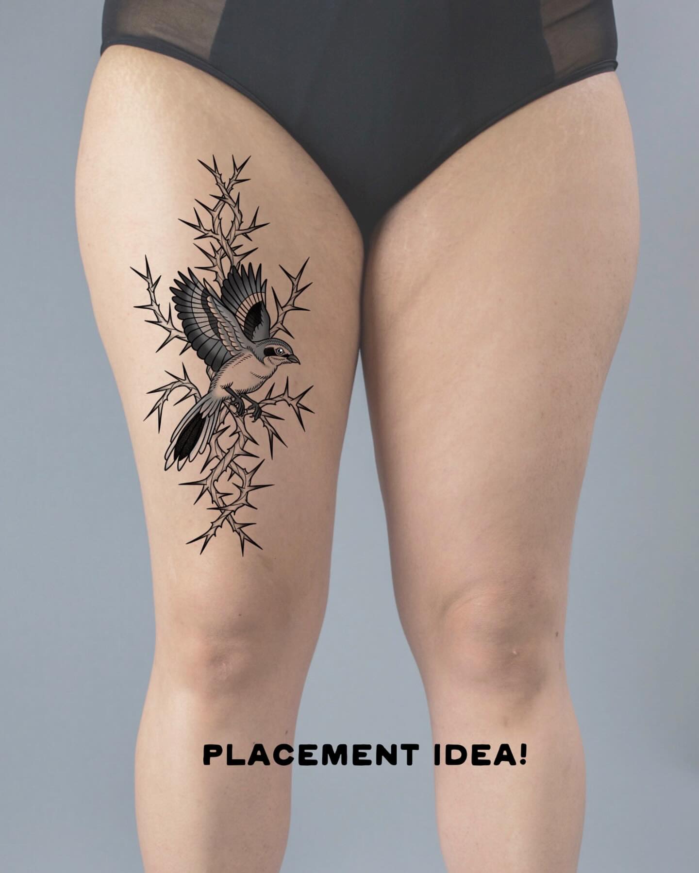 Bird on thorns black and grey tattoo on the thigh by Krista - Tattoo Artist