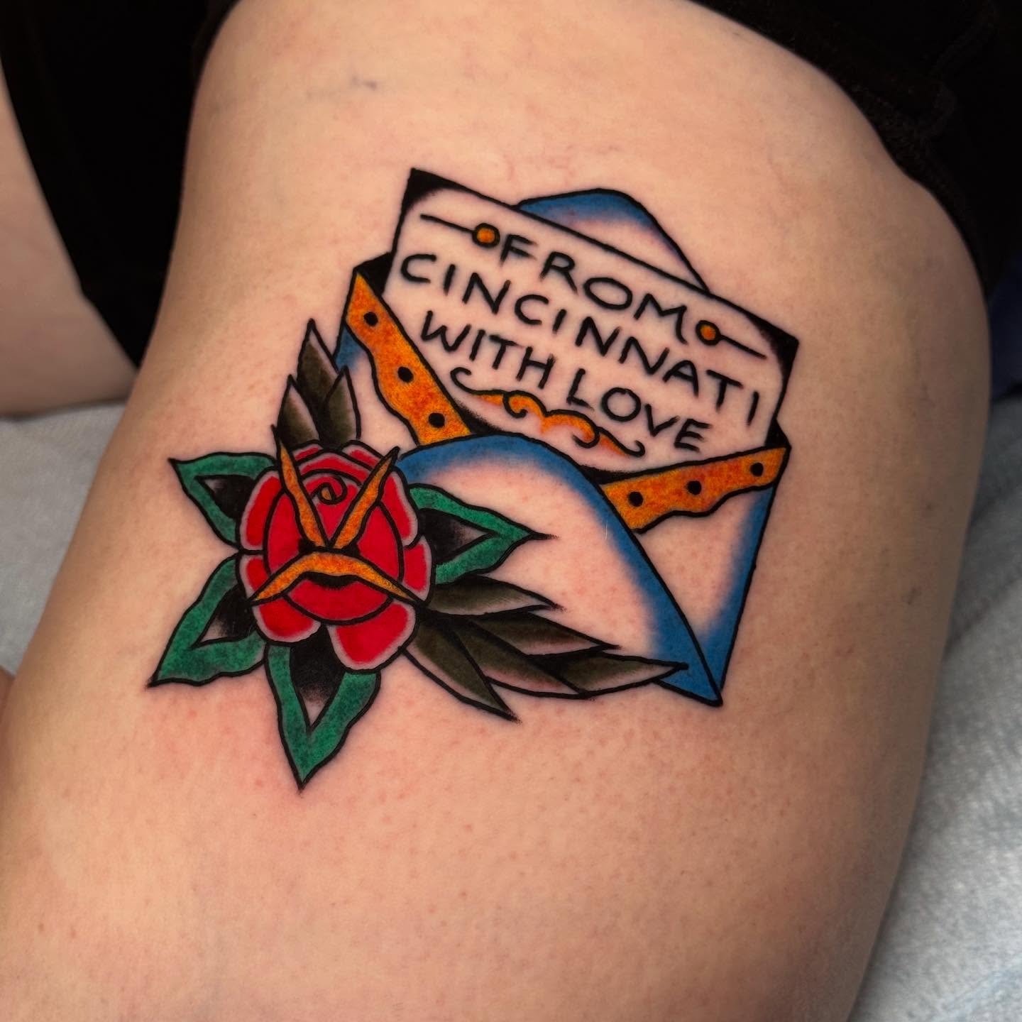 Rose and sign American traditional tattoo on the thigh by JoJo Benton