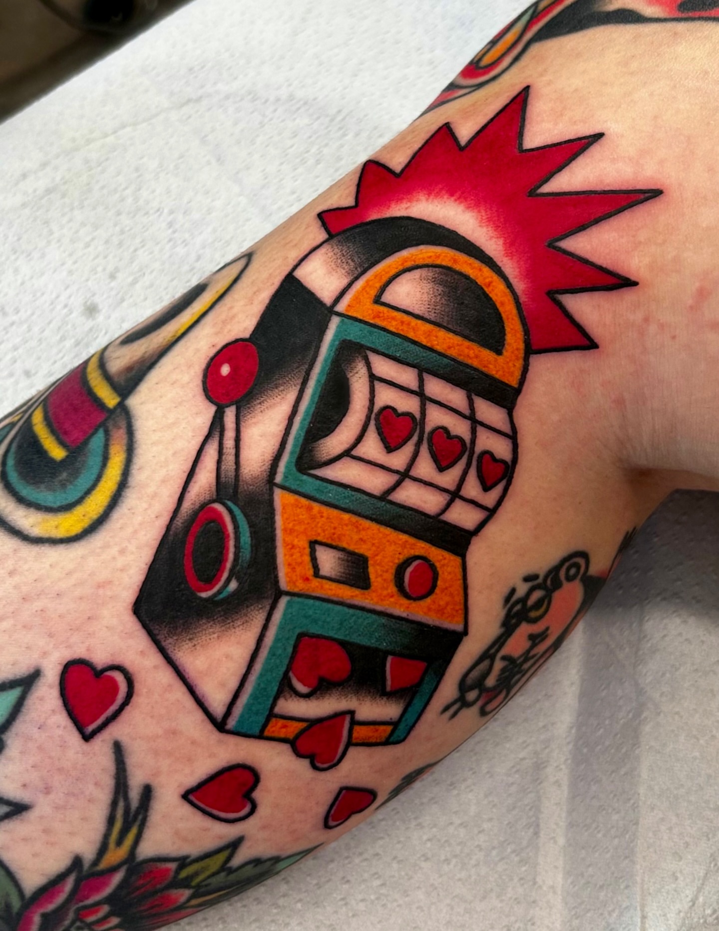 Slot machine American traditional tattoo on the forearm by Kim Goff - Special K