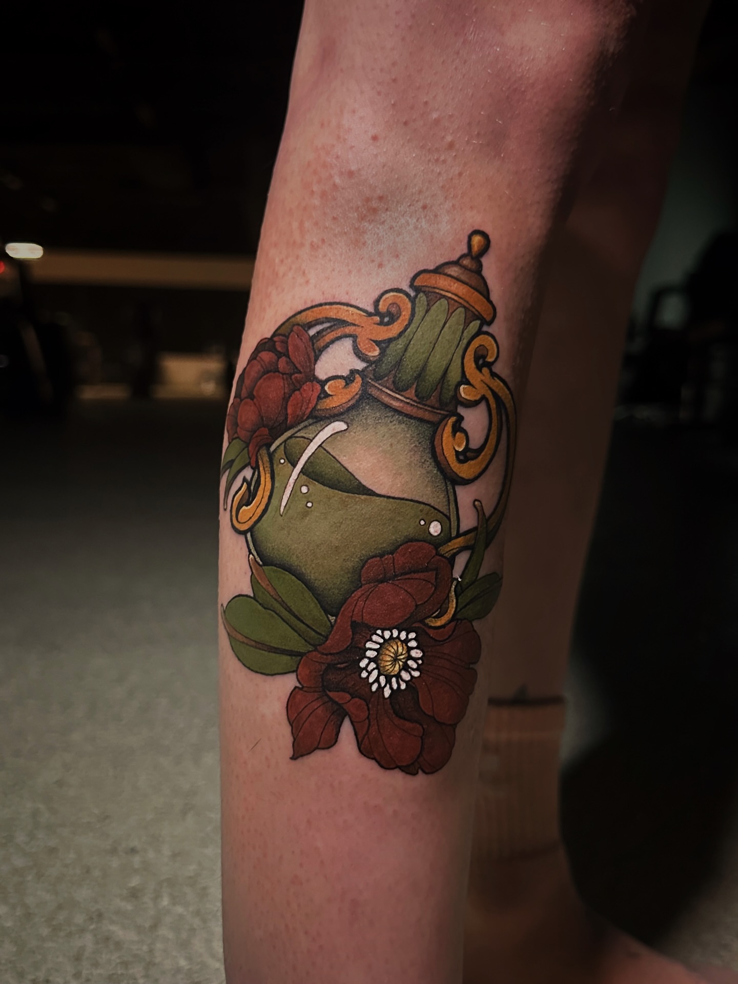 Vase with flowers American traditional tattoo on the forearm by Kelsey Zussman