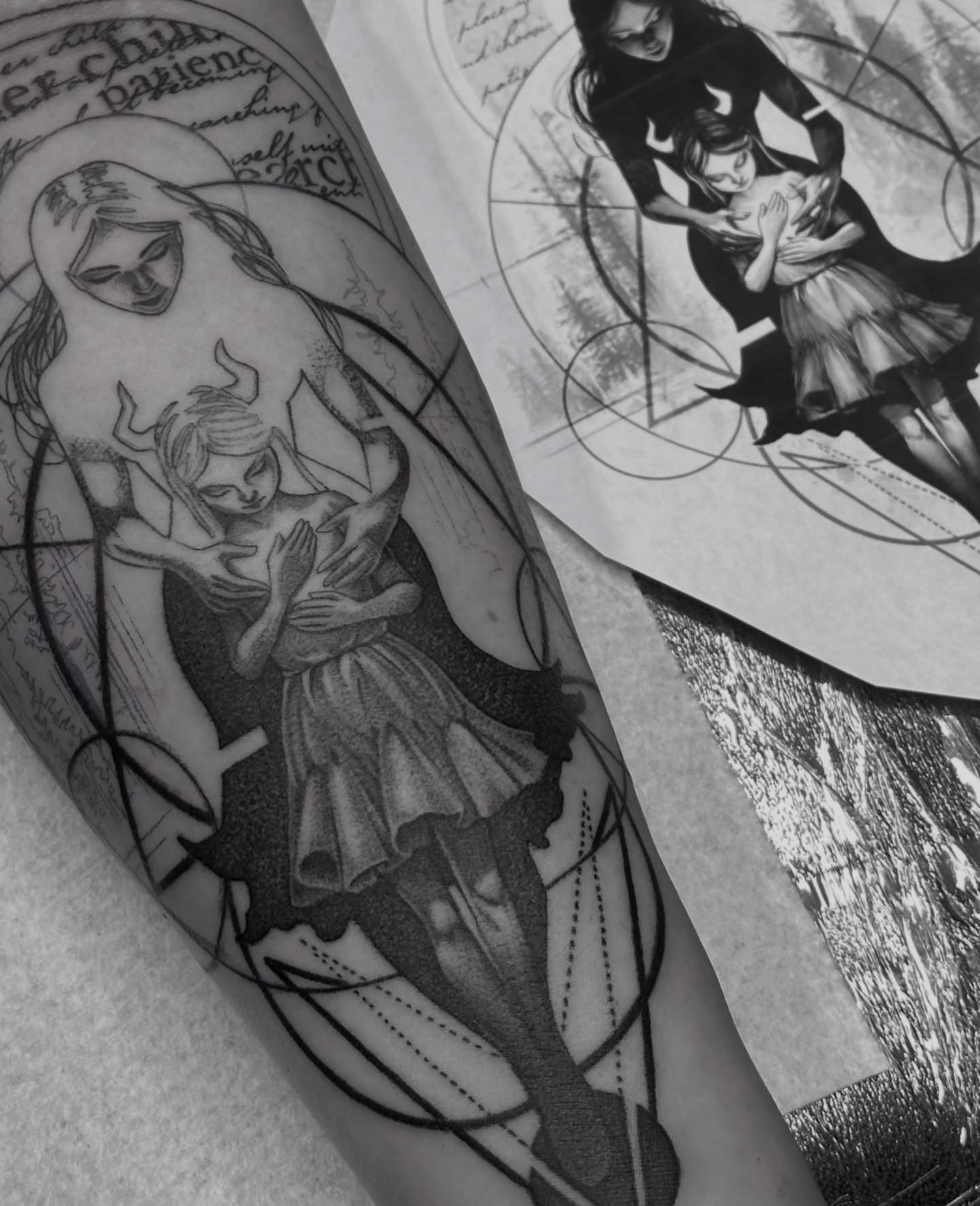 Mother and child geometric tattoo on the forearm by Z.