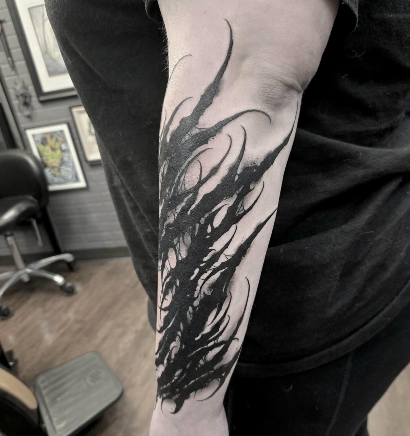 Flame black and grey tattoo on the forearm by ๐