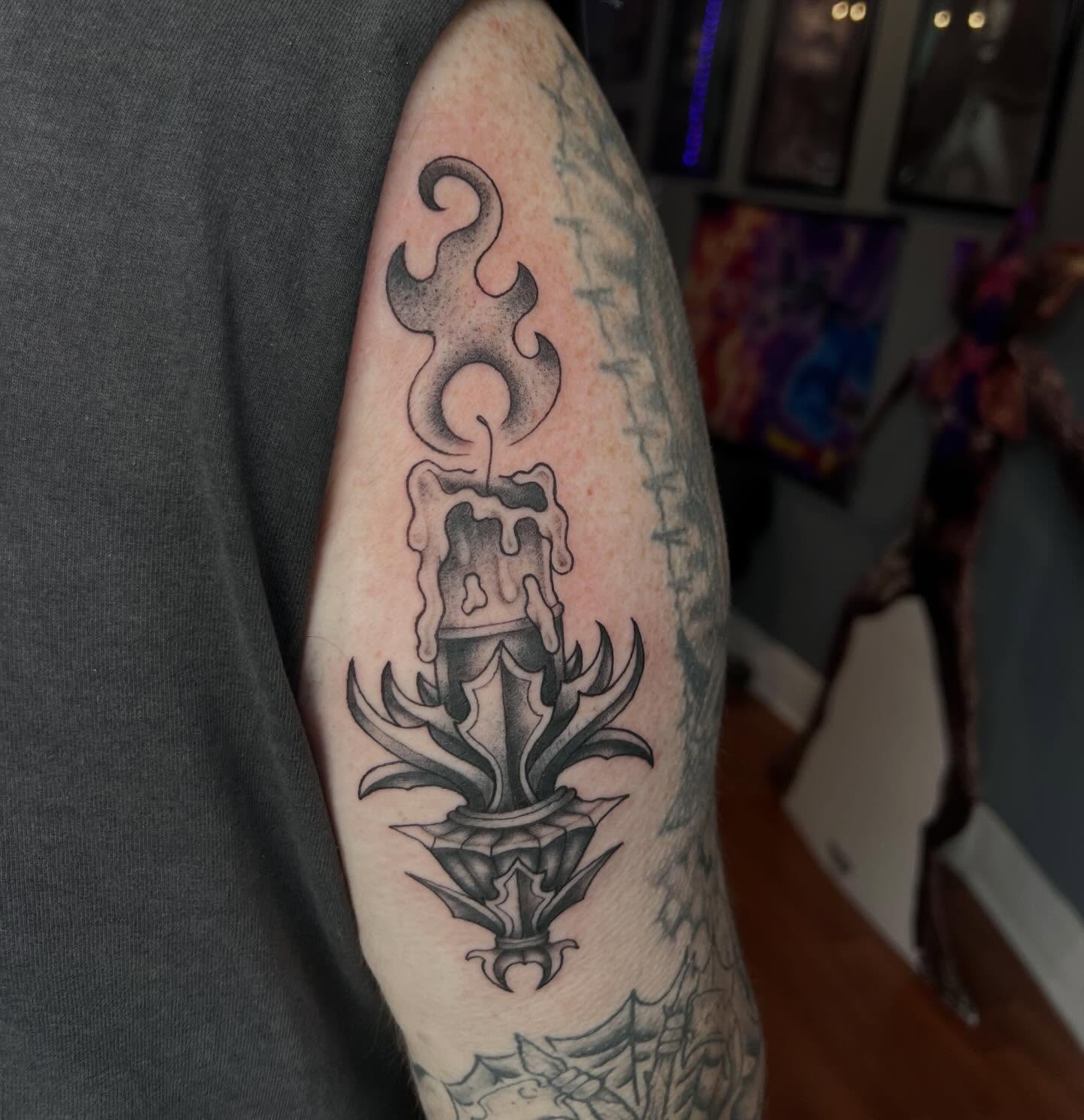 Candle with flames black and grey tattoo on the forearm by Ady Paige