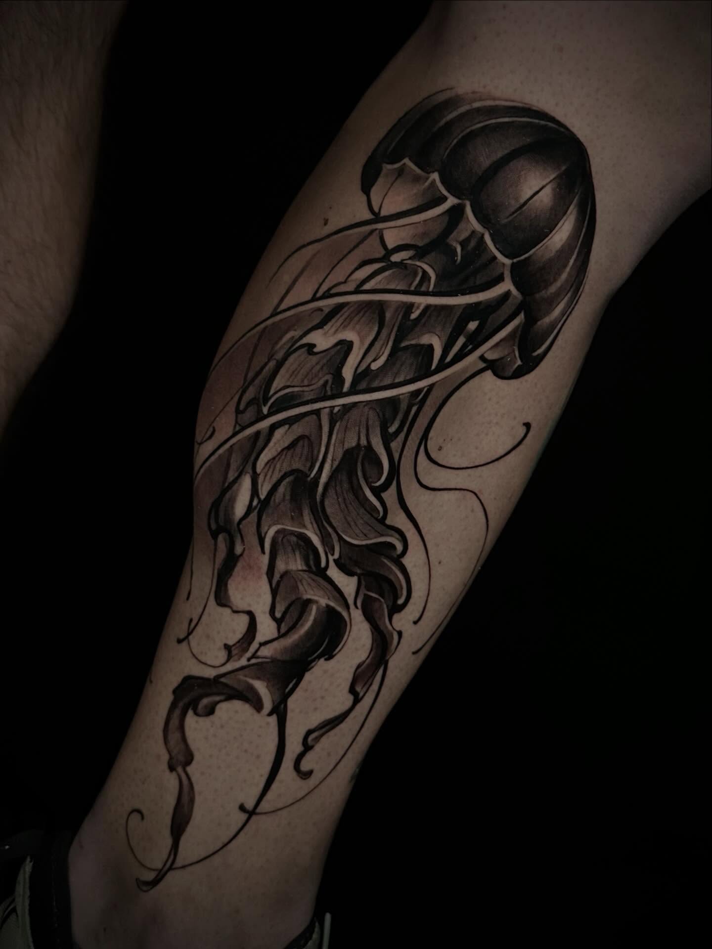 Jellyfish black and grey tattoo on the forearm by Nathan Adsit