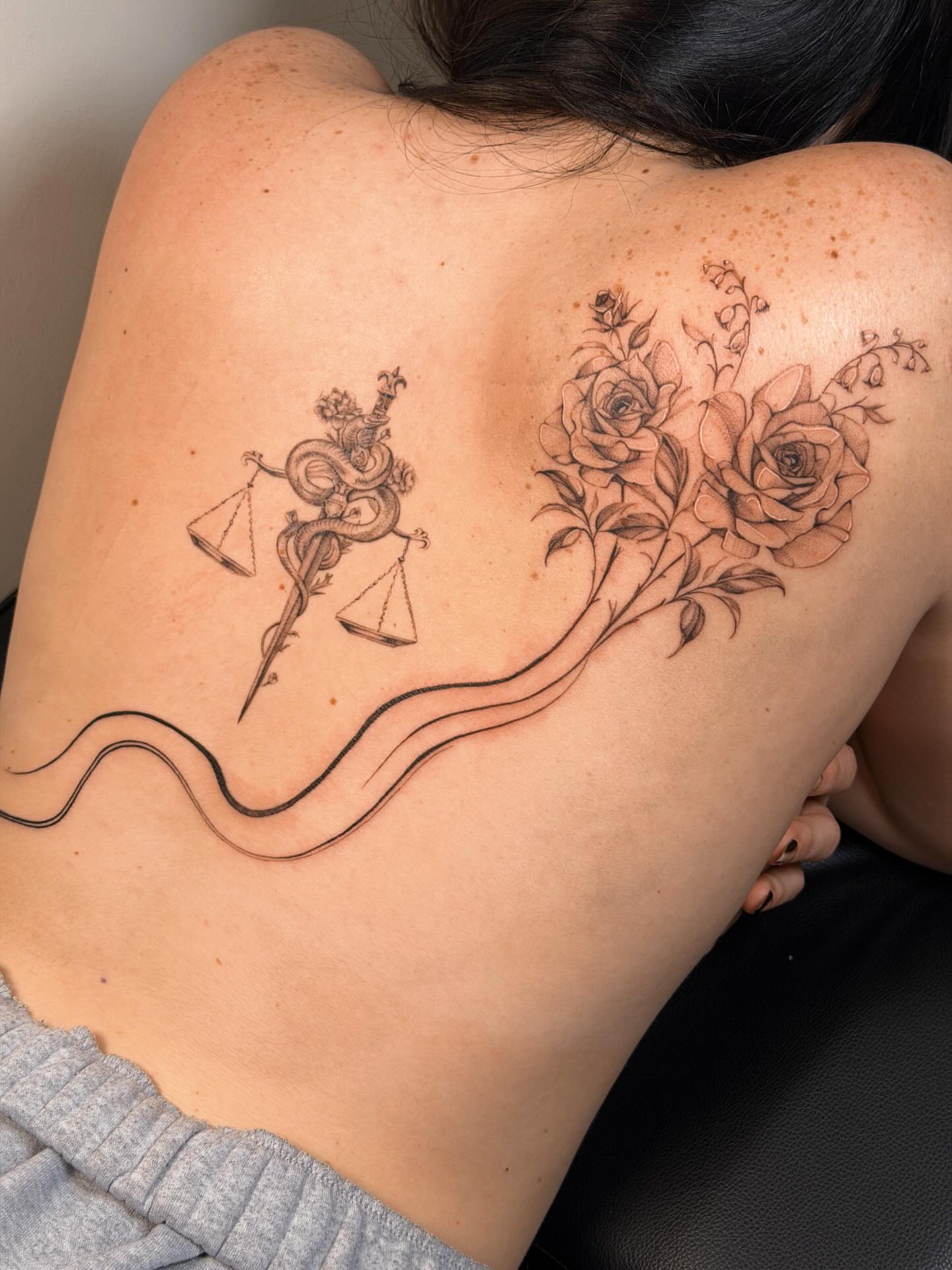 Libra and roses realism tattoo on the back by Nate Weaver