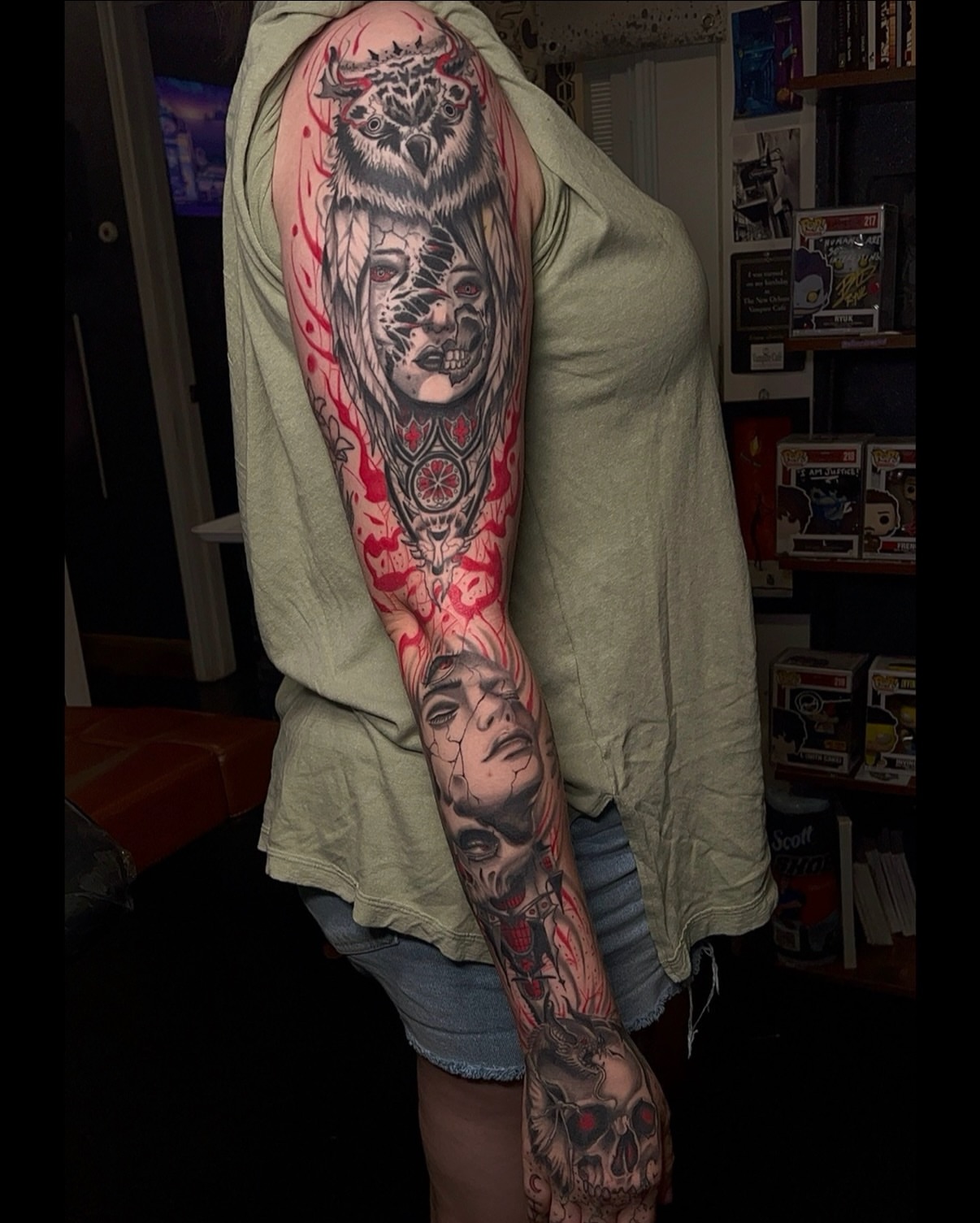 Owl and cracked faces realism tattoo on the upper arm by Denis Seregin