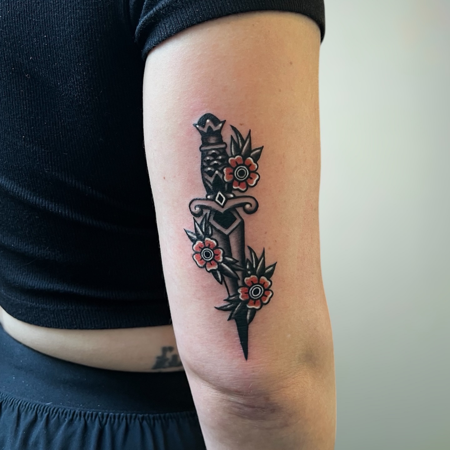 Sword and flowers American traditional tattoo on the forearm by ⚒dptattoos ⚒, East Williamsburg, Brooklyn