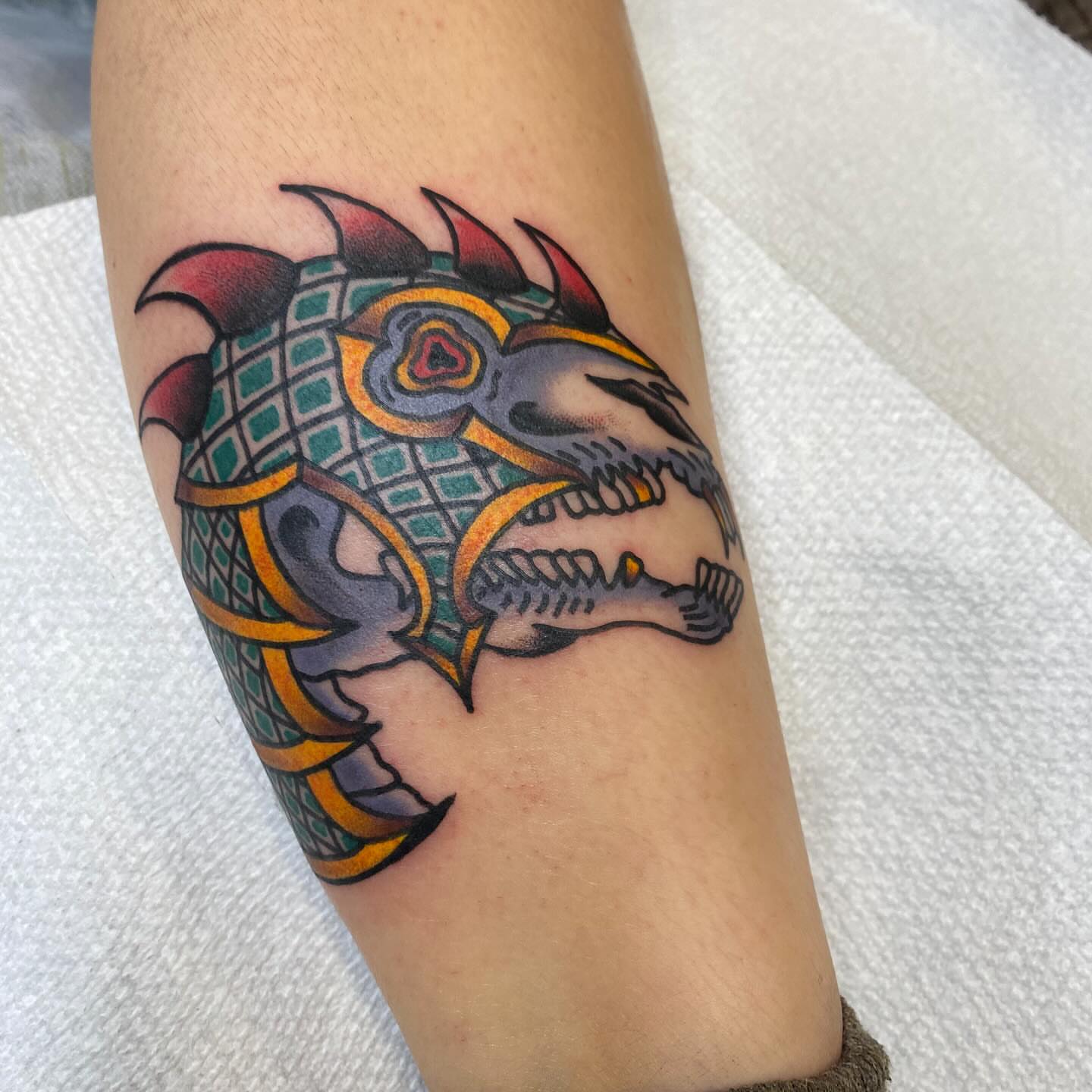 Dragon American traditional tattoo on the forearm by Nosferatu