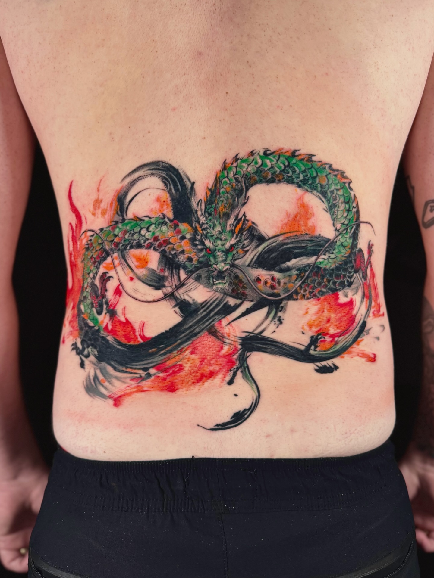 Dragon watercolor tattoo on the back by Abi