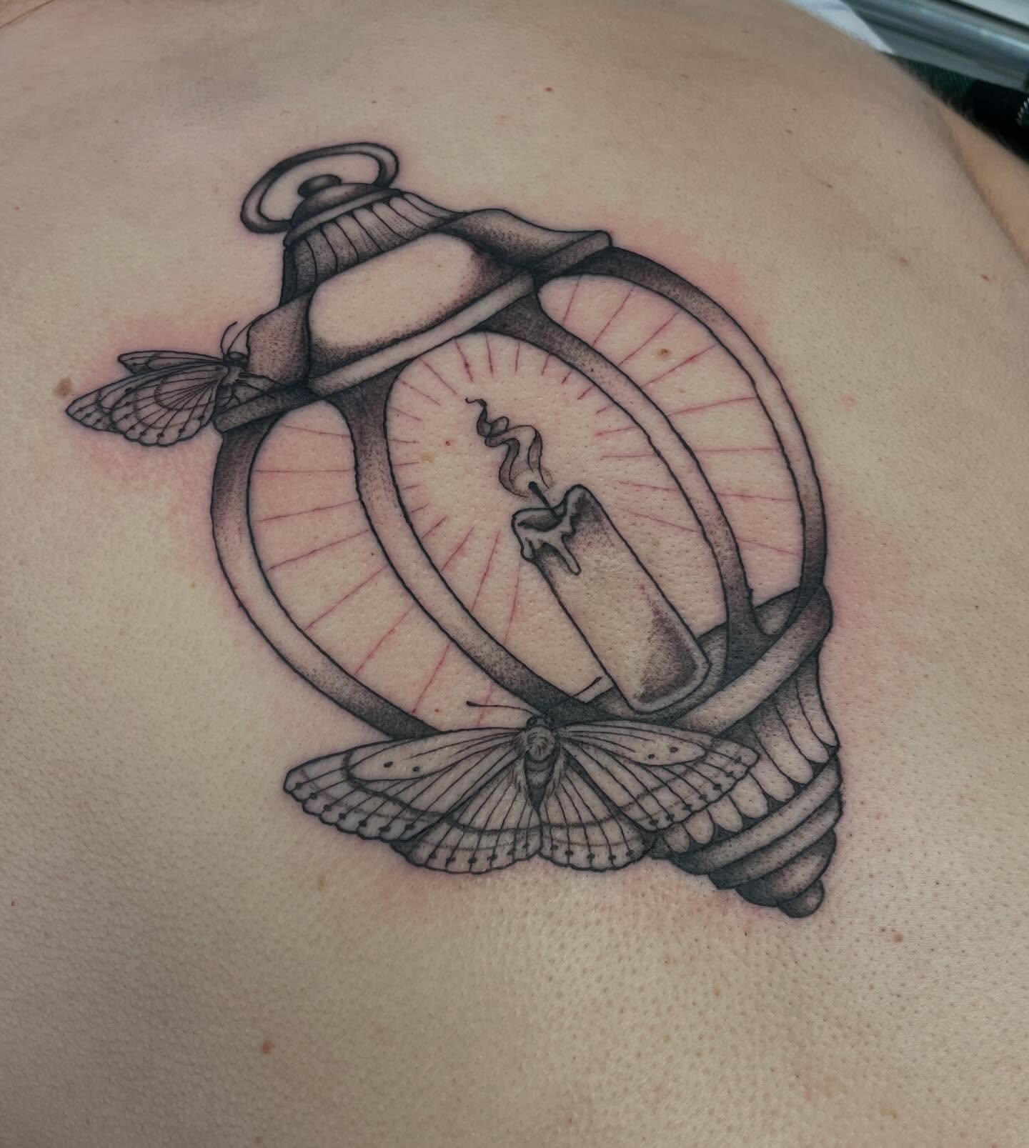Candle and moth realism tattoo on the back by Dayton Tattoo Artist, Miamisburg, Ohio