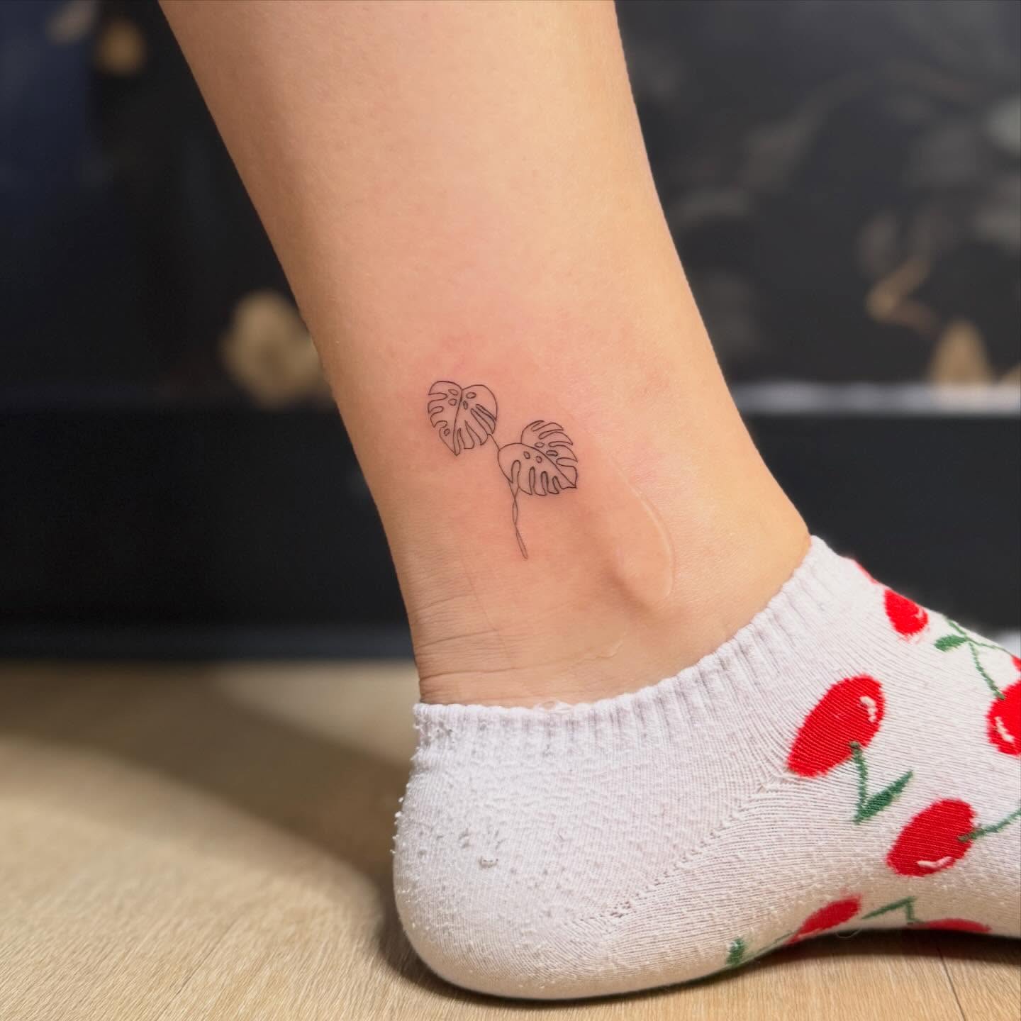 Monstera leaves minimalist tattoo on the foot by Fineline Tattoos π€ Hailey L.