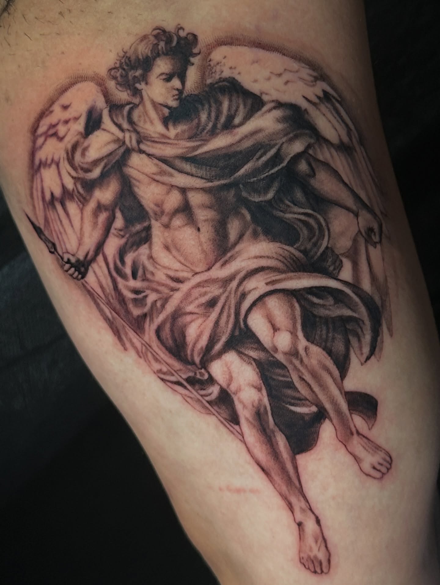 Angel realism tattoo on the thigh by Dennis Alejandro