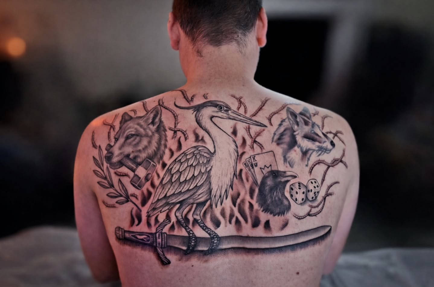 Heron and wolves American traditional tattoo on the back by Luke Jordan Ink, Louisville, Colorado