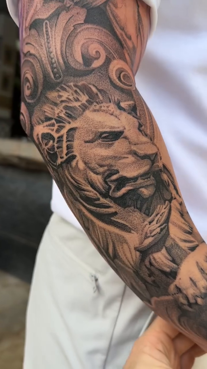 Lion with crown of thorns realism tattoo by Viktor Govorukhin