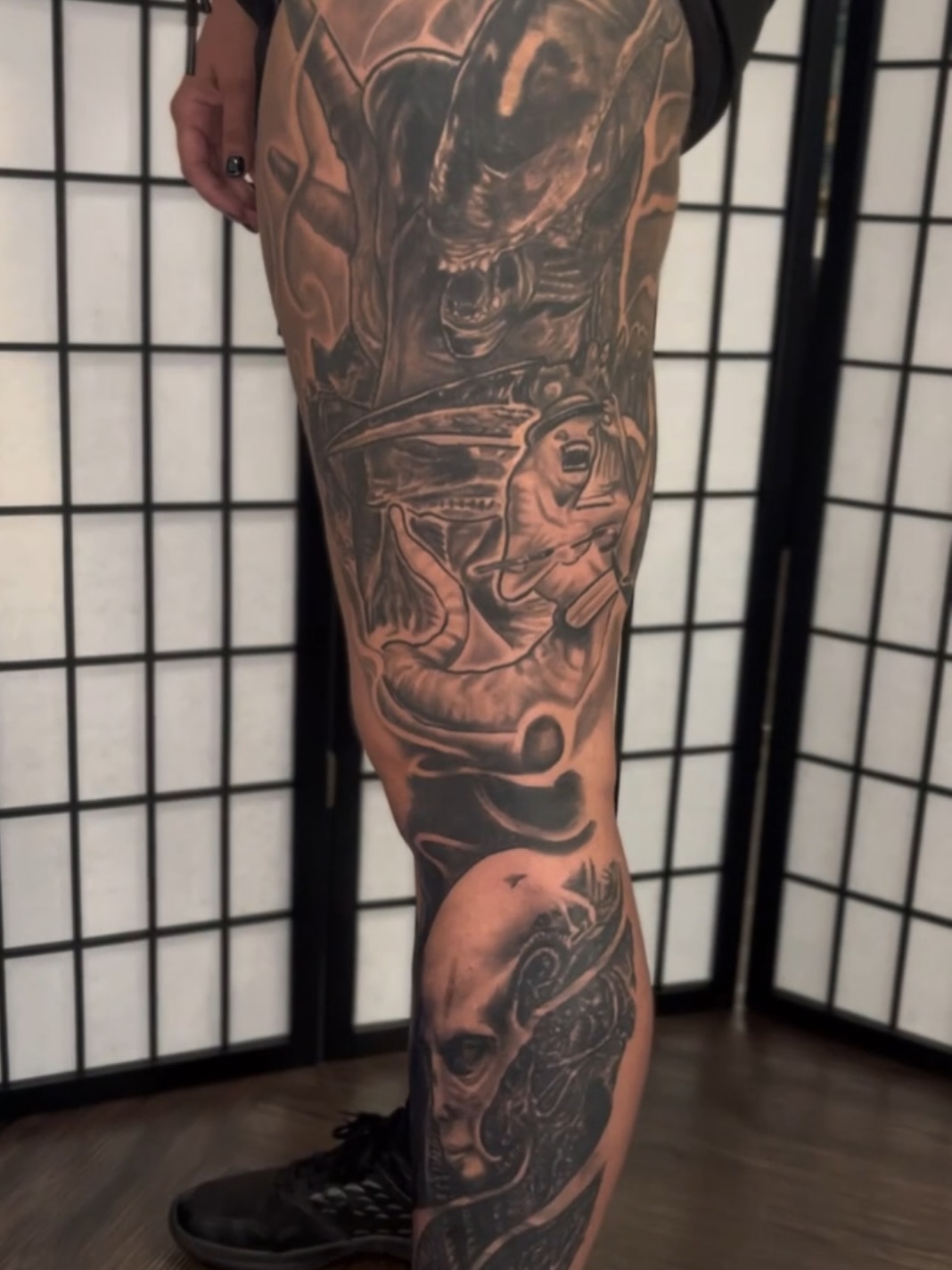 Alien realism tattoo on the leg by C.J. Rued