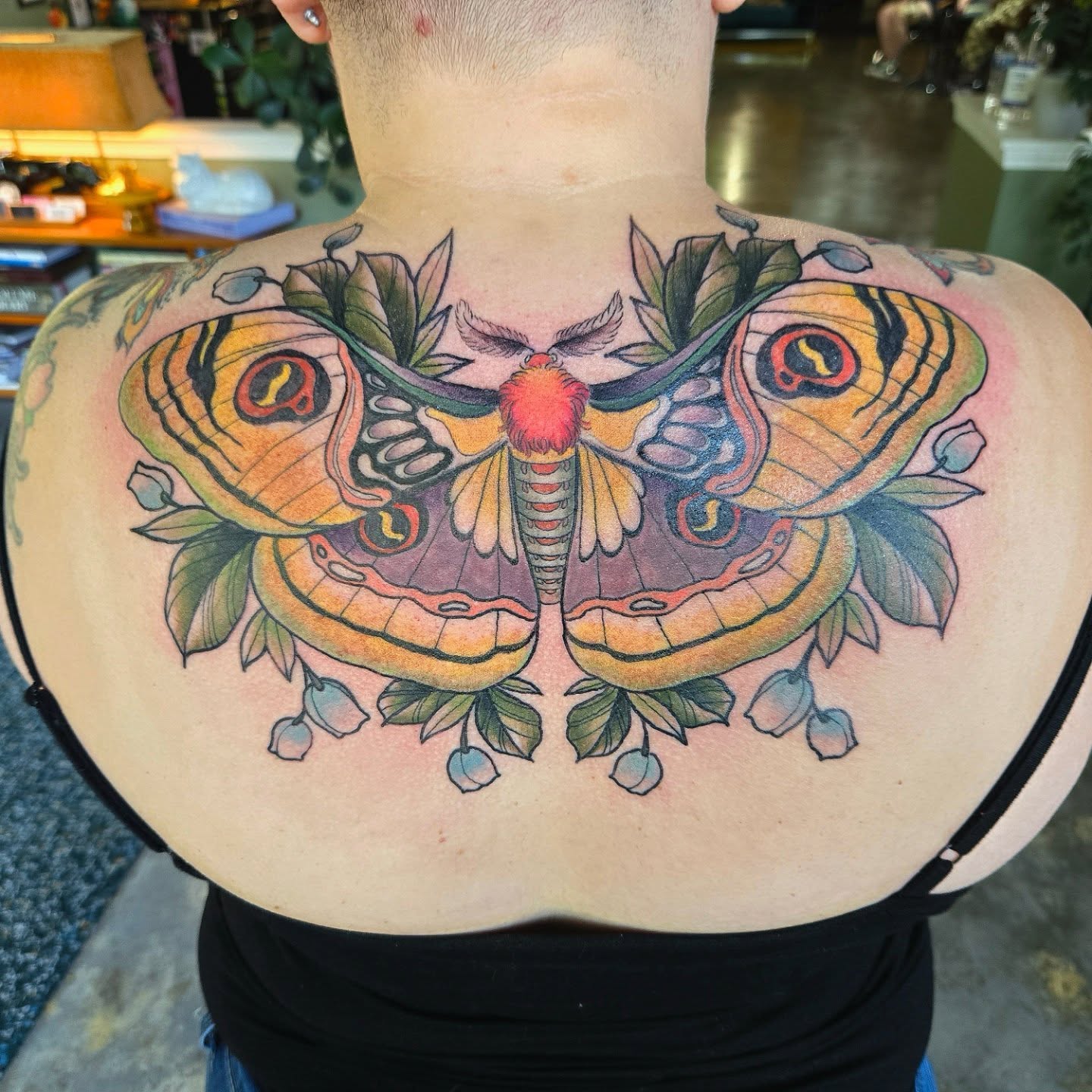 Butterfly illustrative tattoo on the back by Amanda Hinrichs