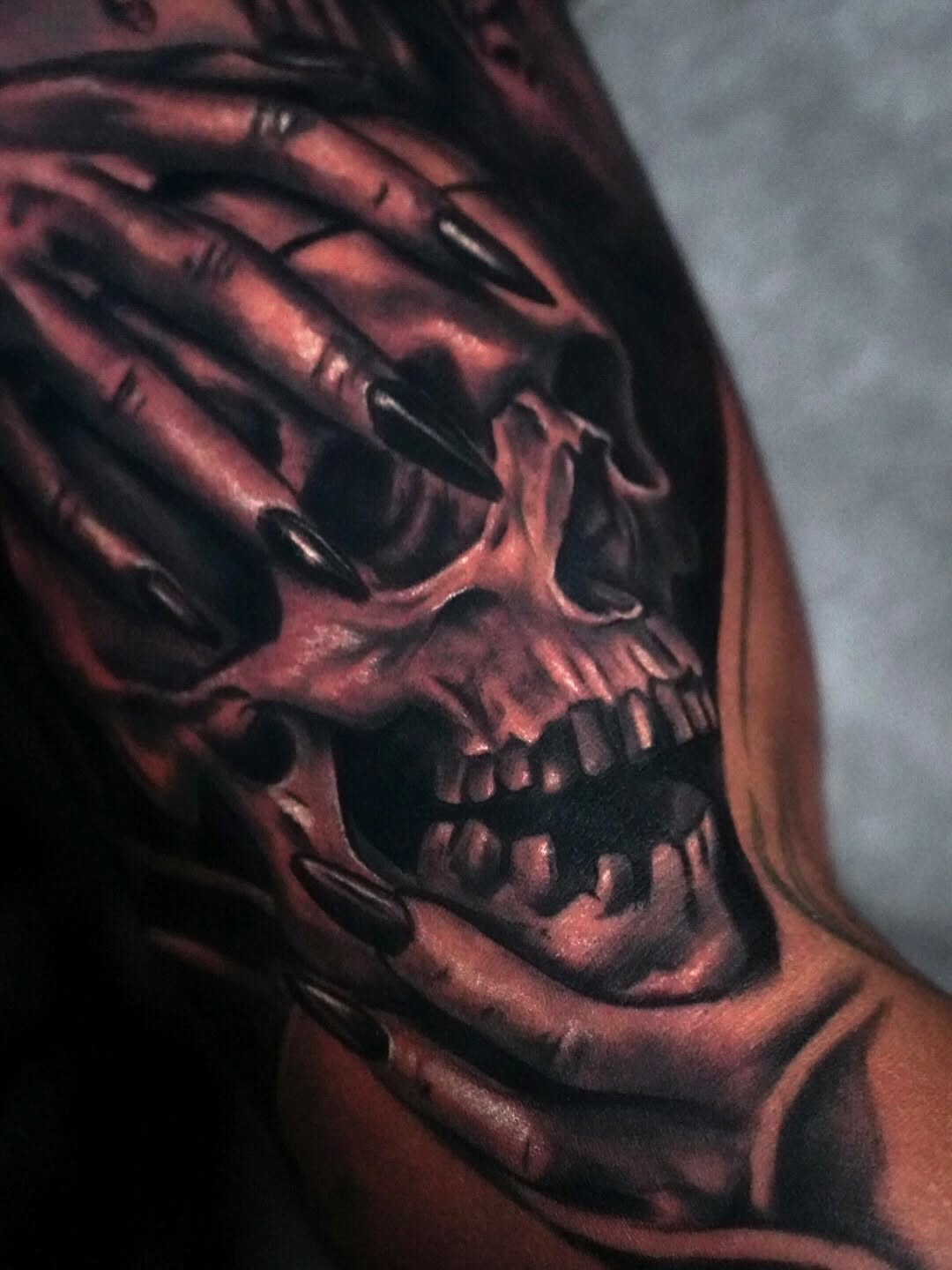 Skull with hands covering eyes realism tattoo on the shoulder by ✝️ Nicholas Fernandez ✝️