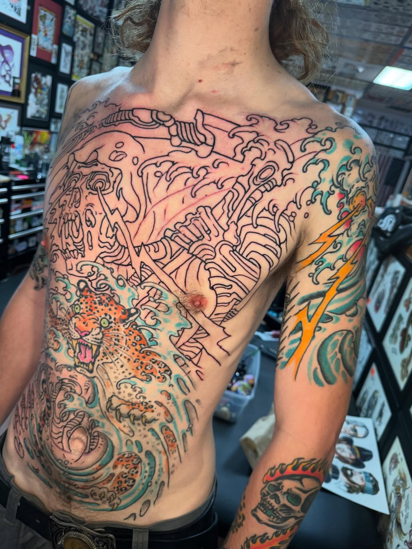 Jungle scene American traditional tattoo on the torso by Tim Lehi, Oakland, California