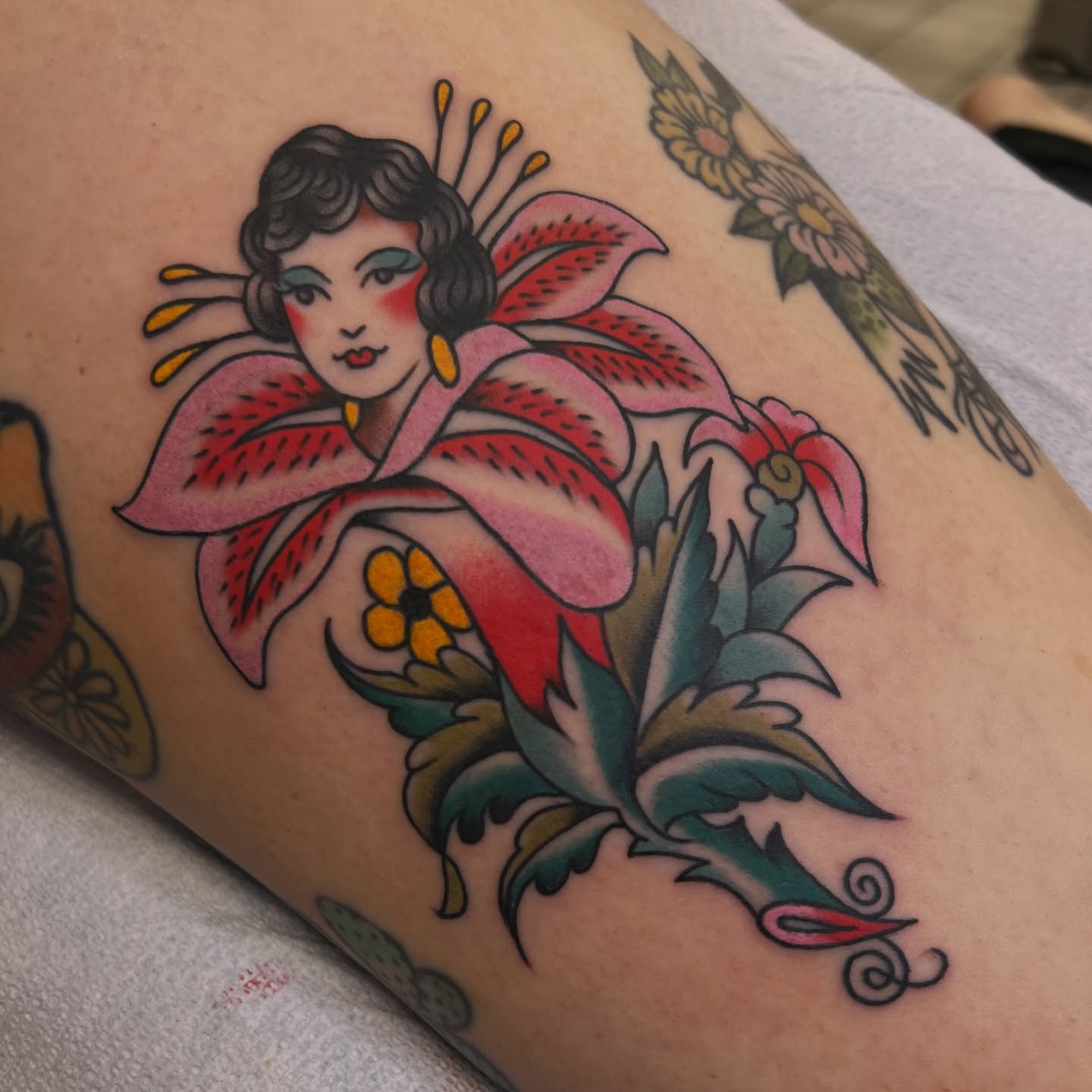 Geisha with lily American traditional tattoo on the forearm by morganhabe