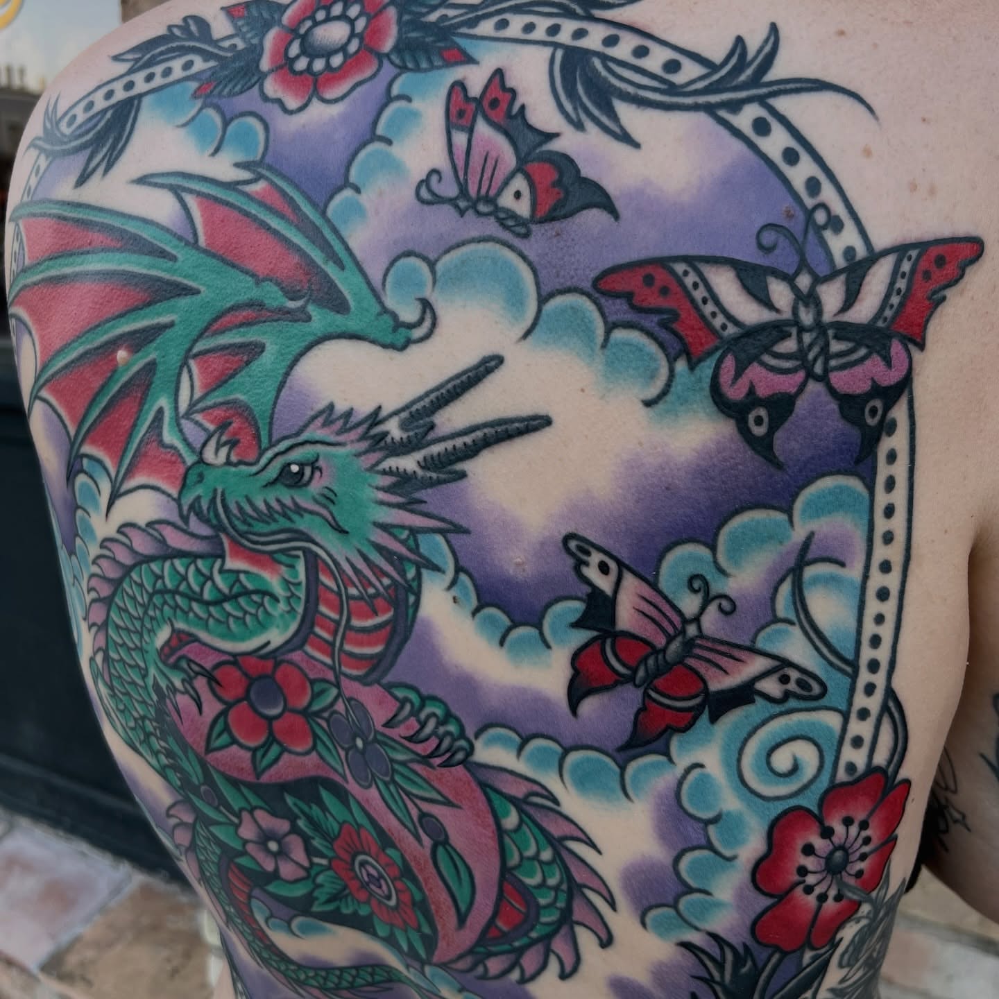 Dragon and butterflies American traditional tattoo on the shoulder by morganhabe
