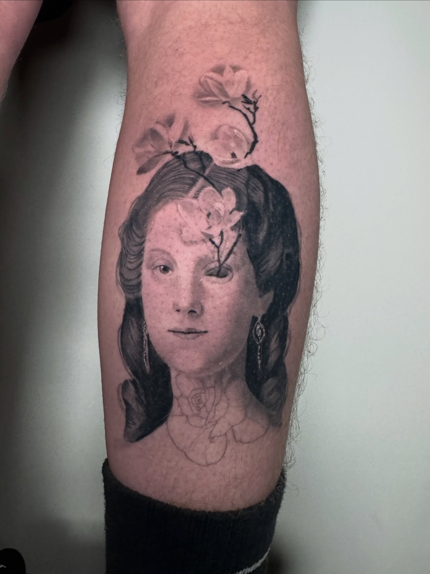 Portrait realism tattoo on the forearm by Tori Bent